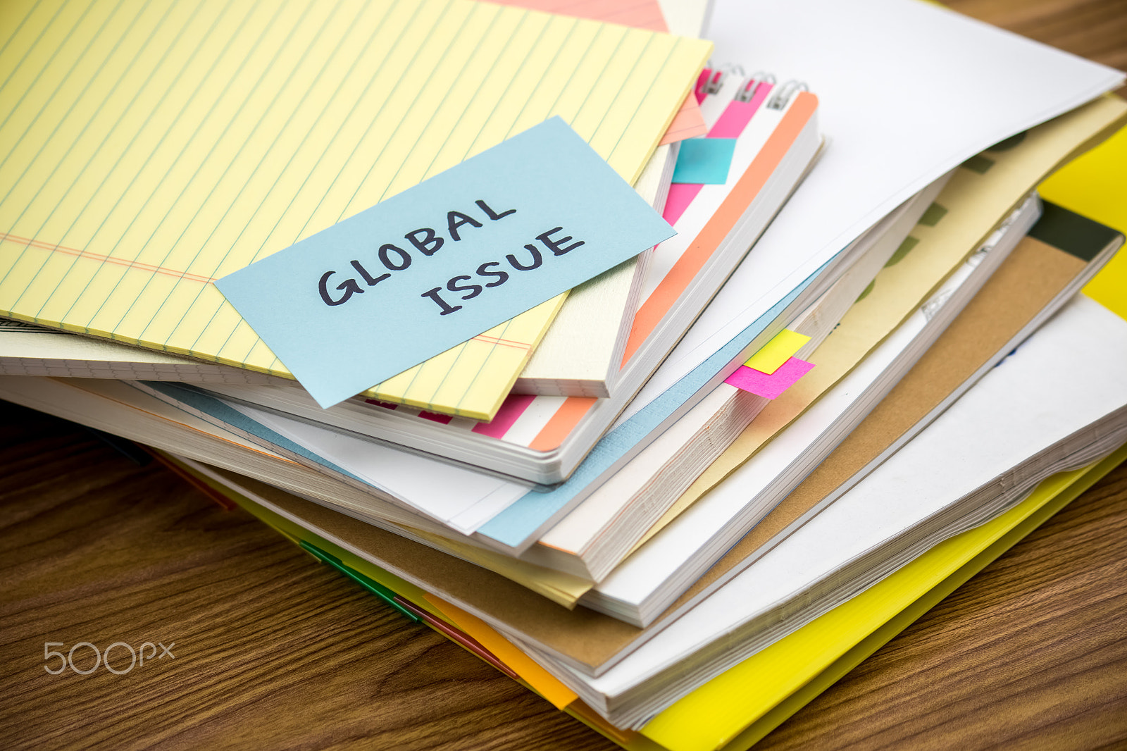 Canon EF-S 55-250mm F4-5.6 IS sample photo. Global issue; the pile of business documents on the desk photography