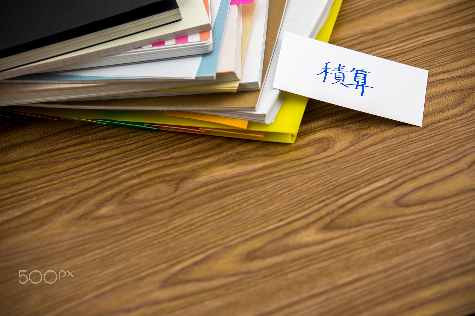 Canon EF-S 55-250mm F4-5.6 IS sample photo. Estimate; the pile of business documents on the desk photography