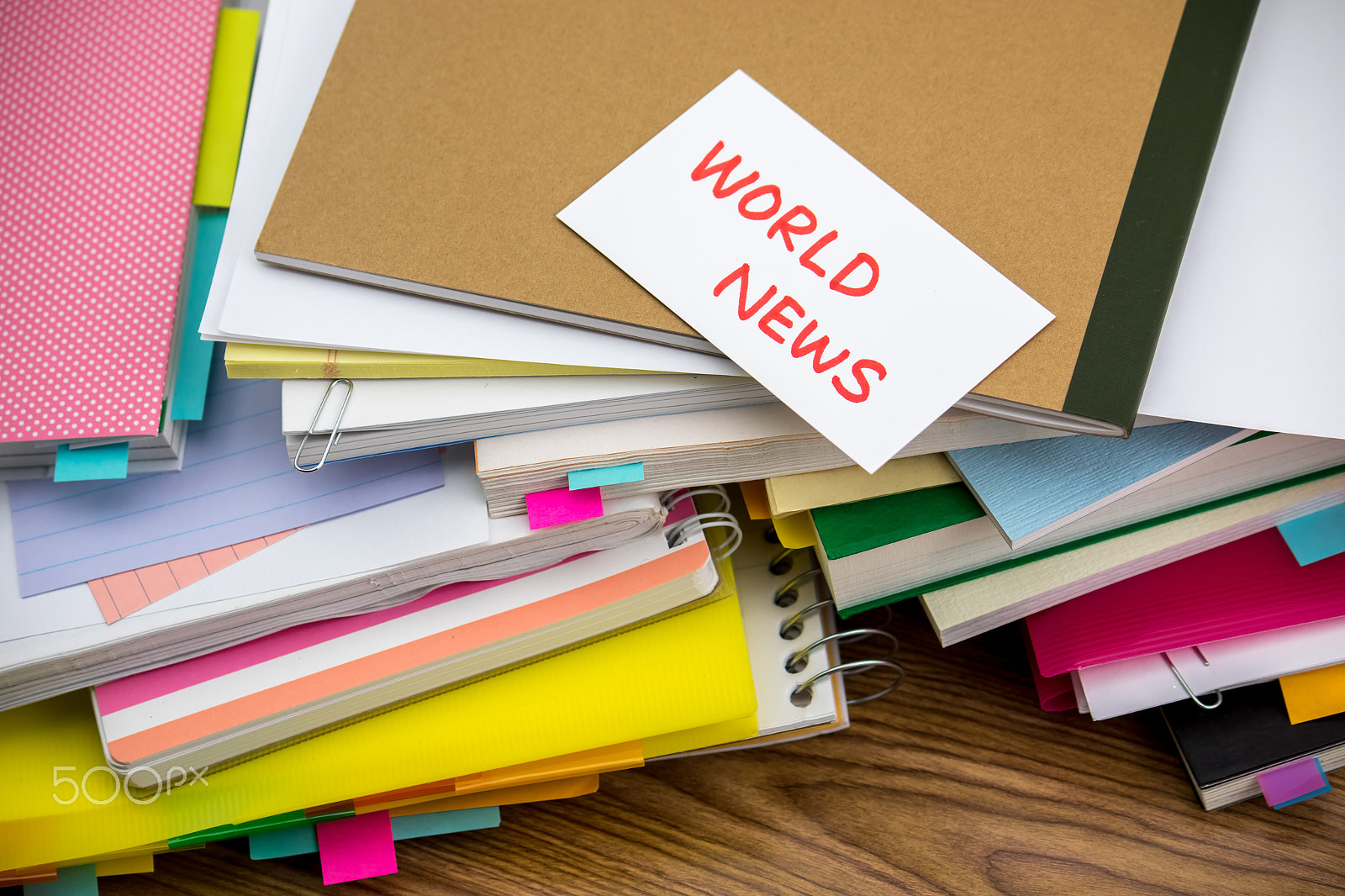 Canon EF-S 55-250mm F4-5.6 IS sample photo. World news; the pile of business documents on the desk photography