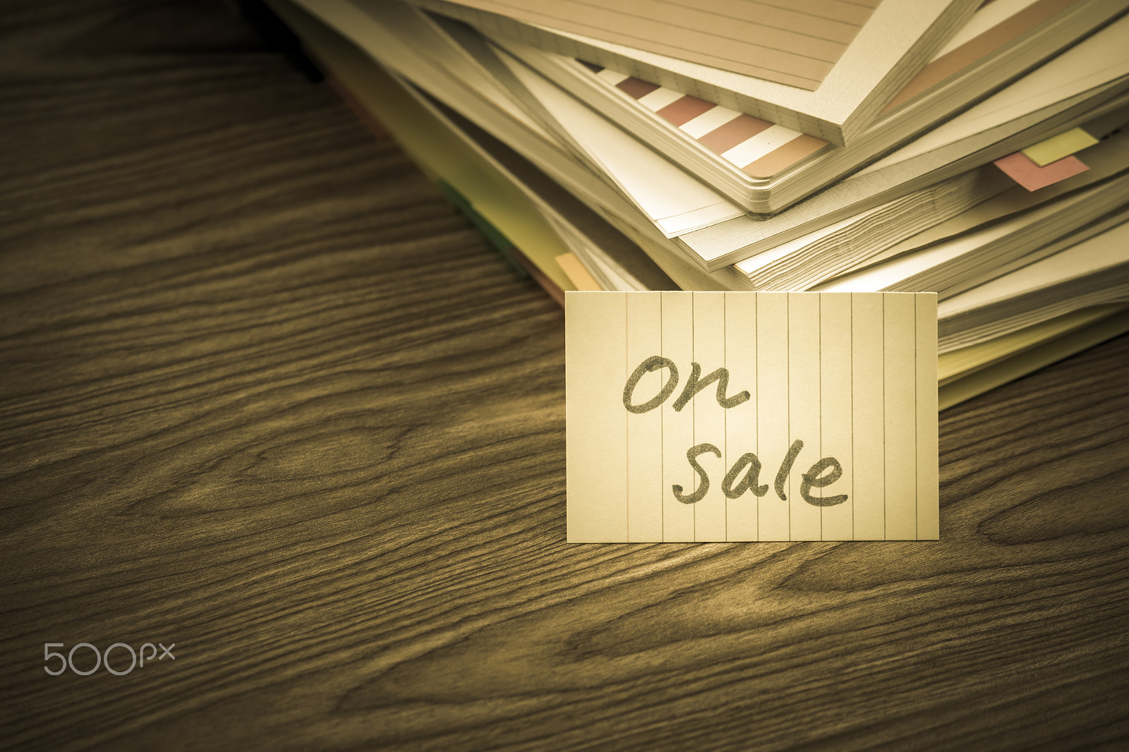 Canon EF-S 55-250mm F4-5.6 IS sample photo. On sale; the pile of business documents on the desk photography