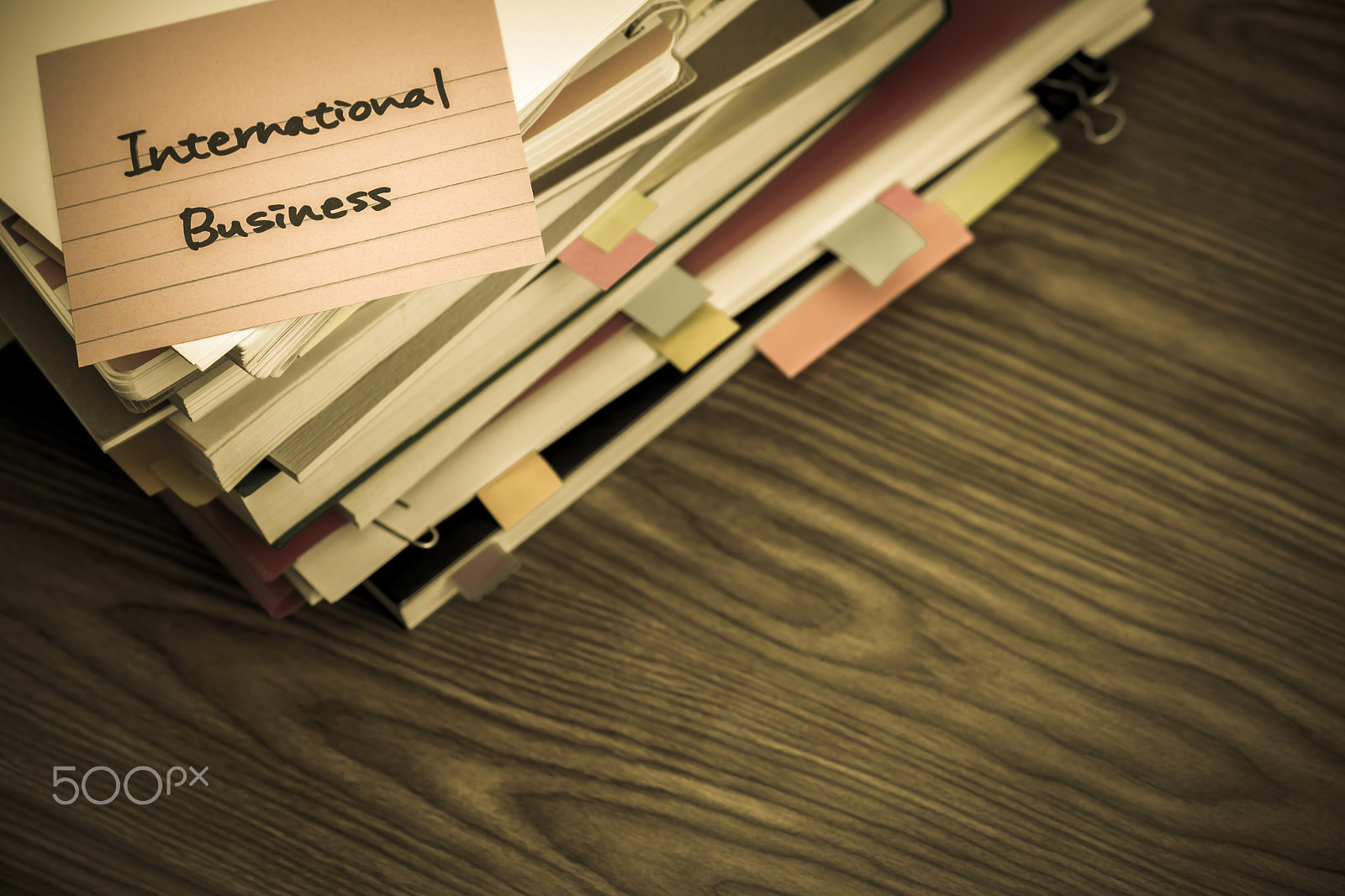 Canon EF-S 55-250mm F4-5.6 IS sample photo. International business; the pile of business documents on the de photography