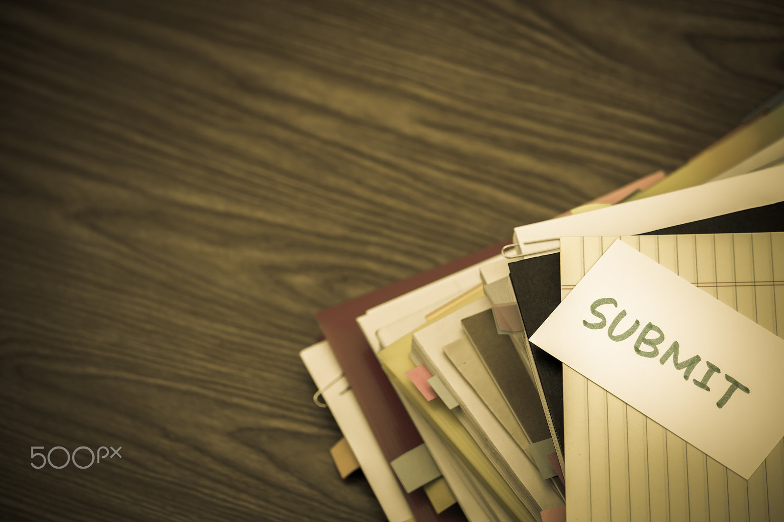 Canon EF-S 55-250mm F4-5.6 IS sample photo. Submit; the pile of business documents on the desk photography