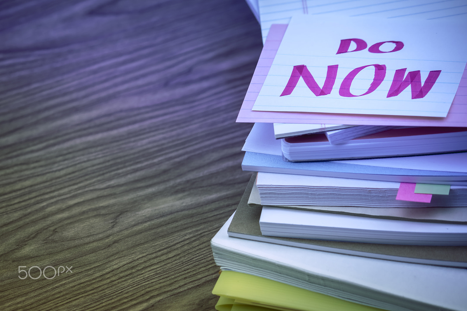 Canon EF-S 55-250mm F4-5.6 IS sample photo. Do now; the pile of business documents on the desk photography