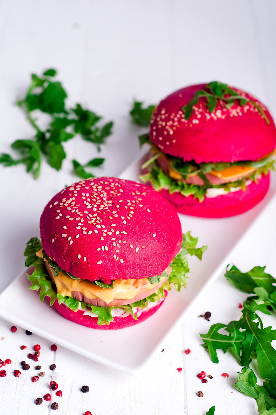 Nikon D90 sample photo. Tasty burger with, sausage, lettuce and mayonnaise served on a white plate photography