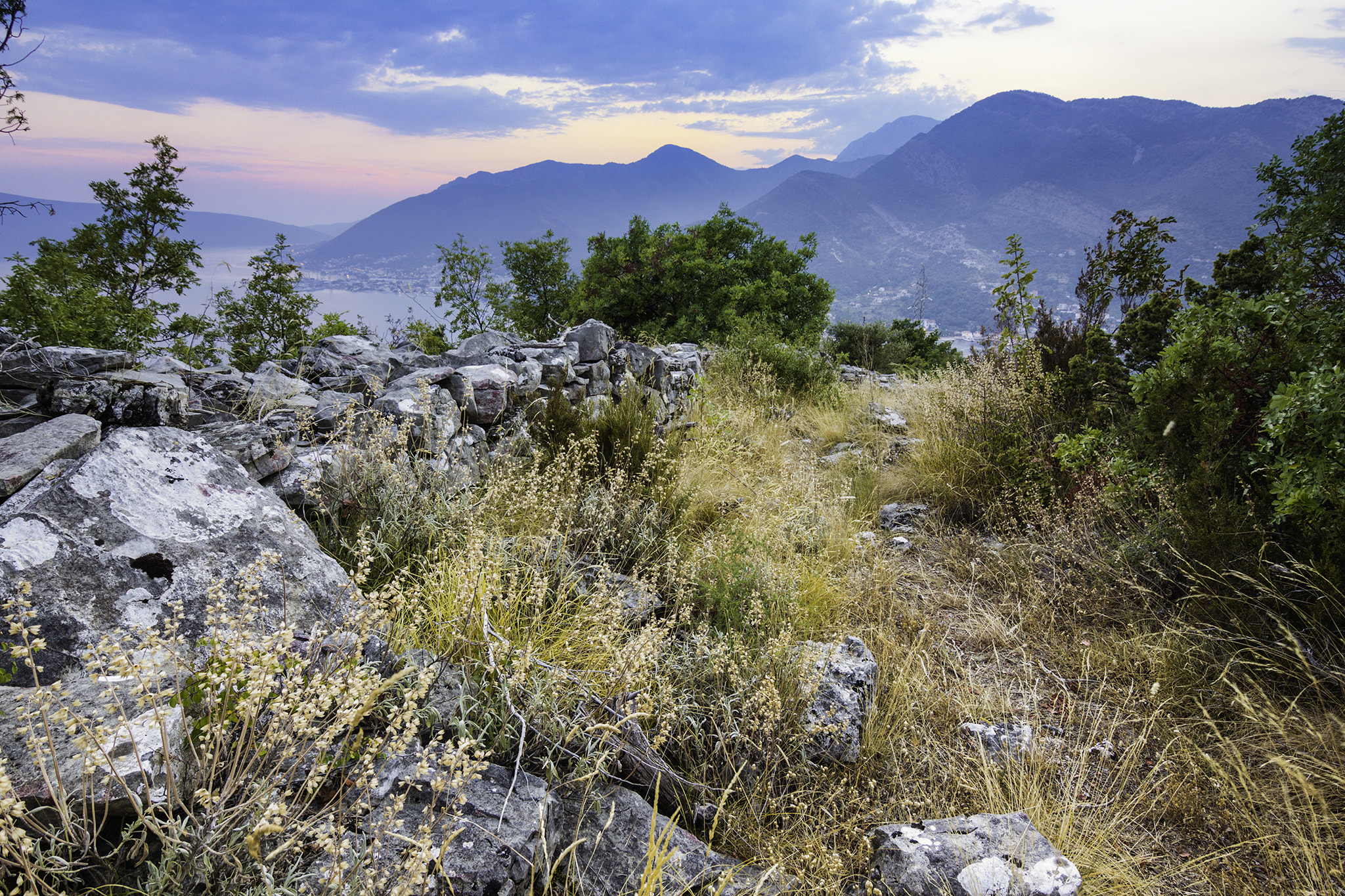 Tokina AT-X 12-28mm F4 Pro DX sample photo. Sunset scenery of mountains and sea in montenegro photography