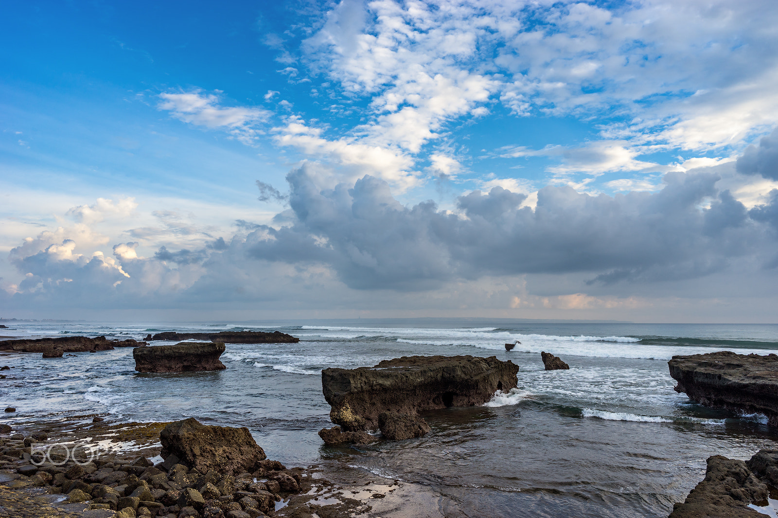 Sony a7 II + ZEISS Batis 25mm F2 sample photo. Coastline with rocks and stones. bali. indonesia. photography