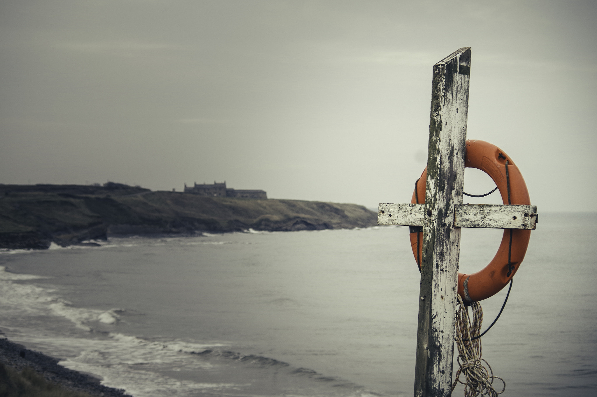 Pentax K-30 sample photo. Life-ring and distant houses photography