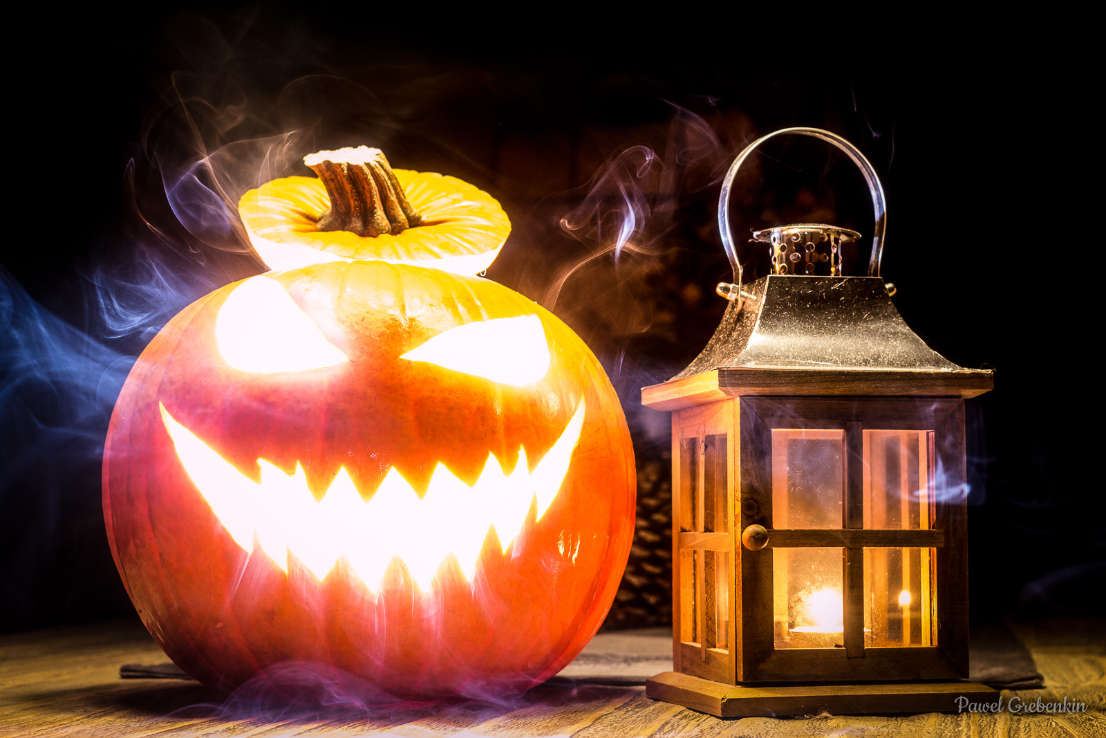 Canon EOS 700D (EOS Rebel T5i / EOS Kiss X7i) + Canon EF 40mm F2.8 STM sample photo. Halloween pumpkin with lantern and mystic smoke photography