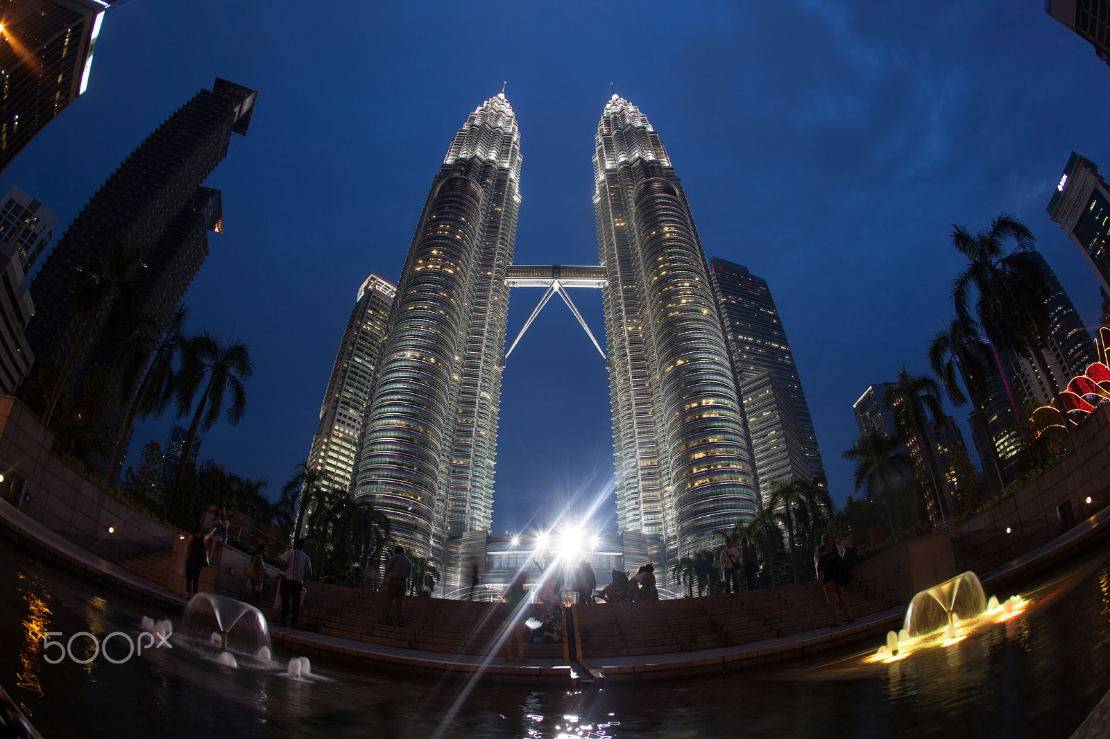 Canon EF 15mm F2.8 Fisheye sample photo. People near petronas towers at night, kuala lumpur photography