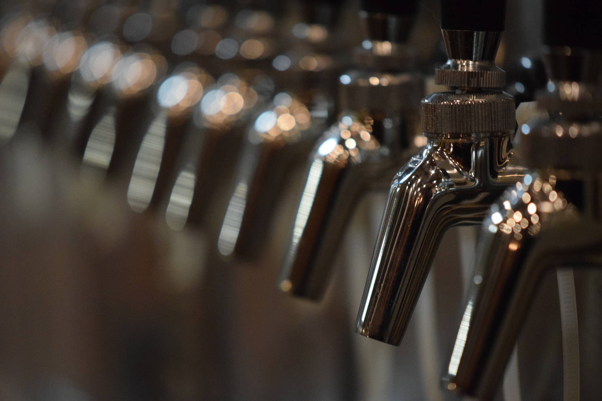 Nikon AF-S DX Micro-Nikkor 85mm F3.5G ED VR sample photo. Beer taps photography