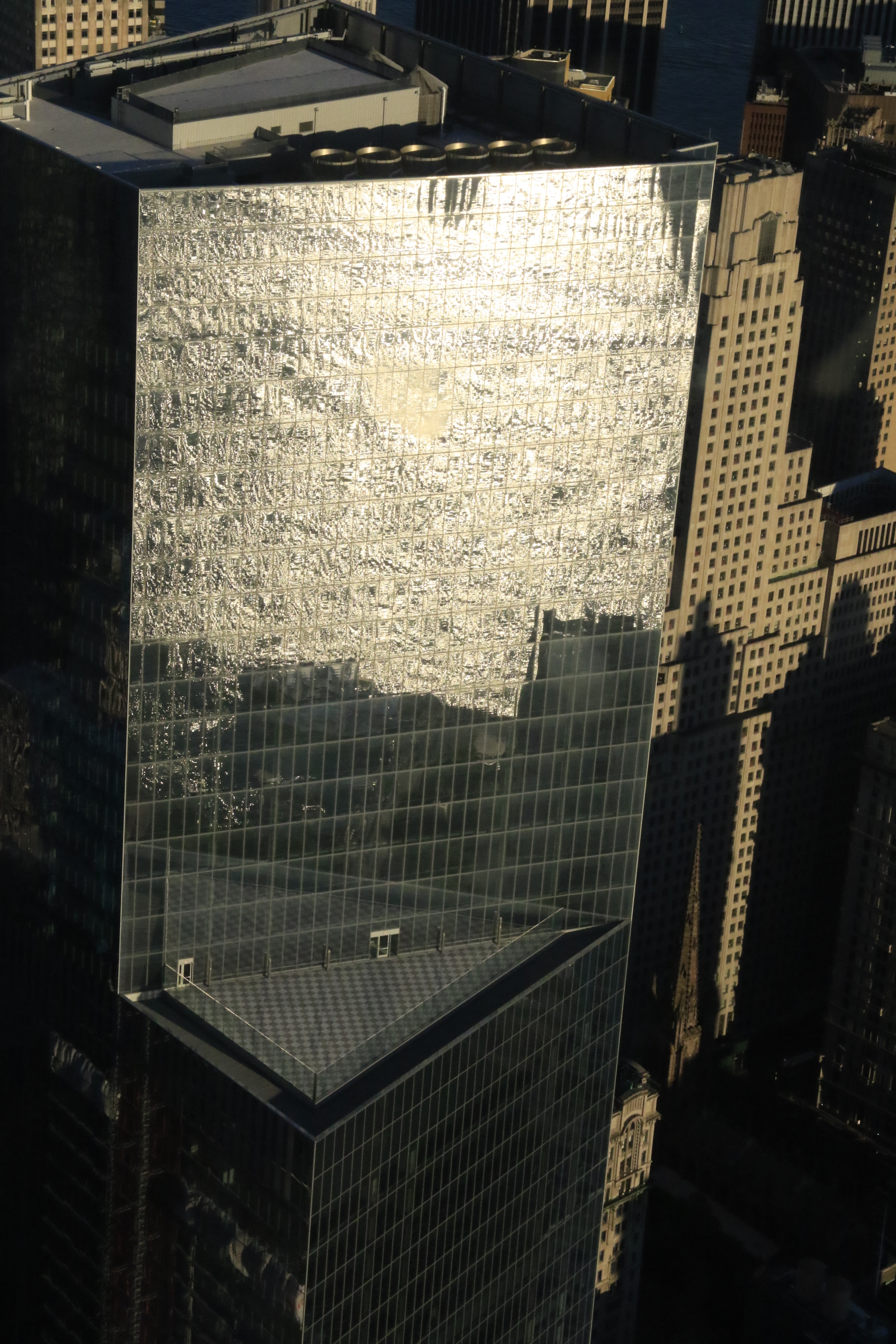 Canon EF-S 18-135mm F3.5-5.6 IS sample photo. Manhattan ocean reflexion in a sunset building, ana osorio. photography