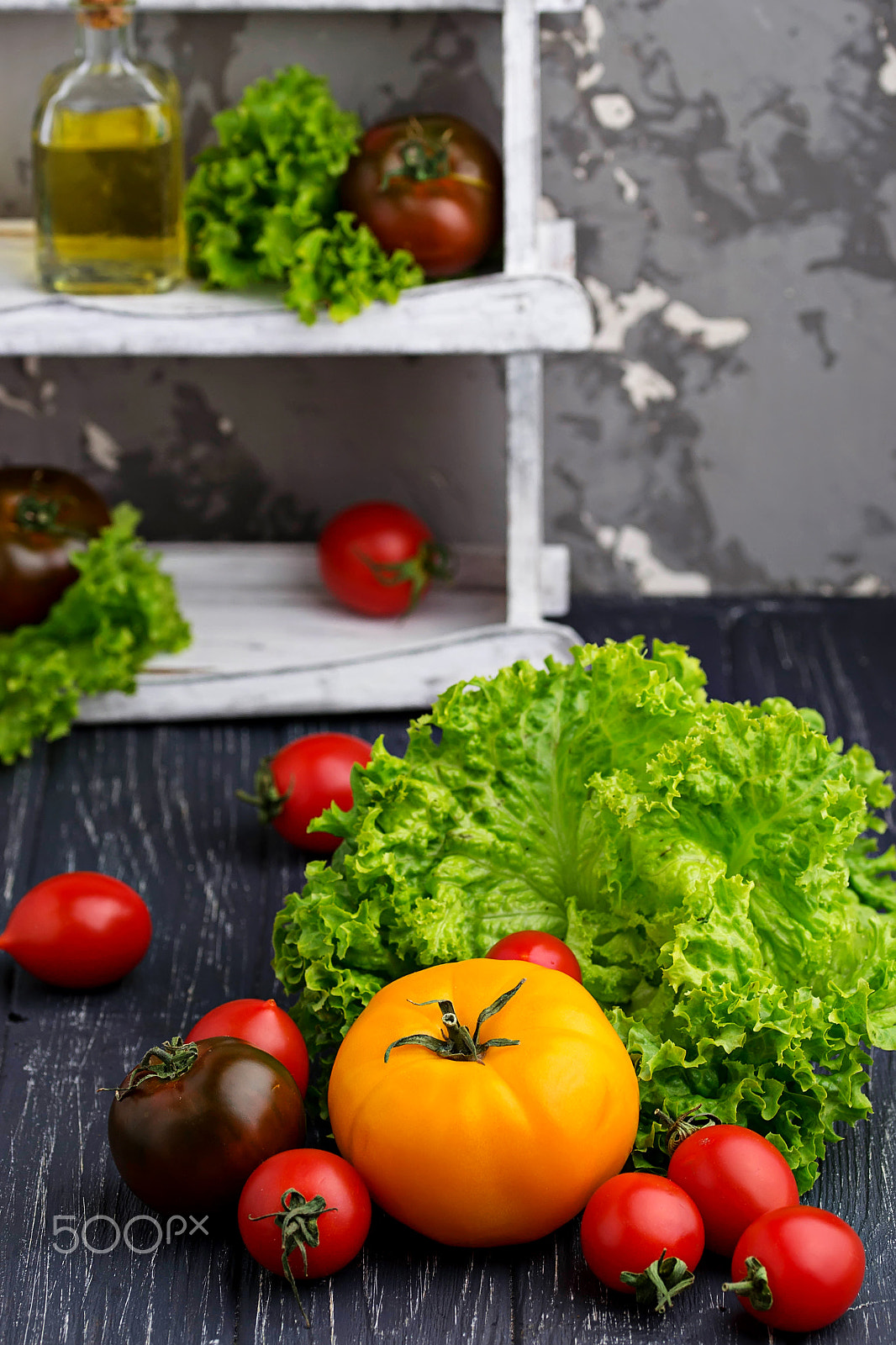 Sigma 105mm F2.8 EX DG OS HSM sample photo. Colorful tomatoes on black background photography