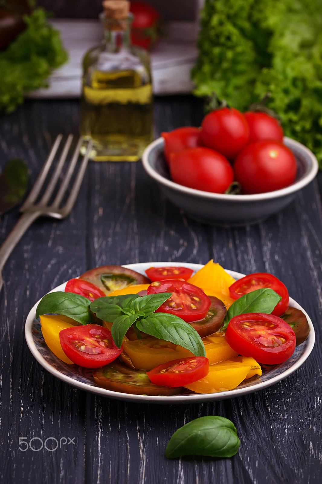 Sigma 105mm F2.8 EX DG OS HSM sample photo. Colorful tomatoes salad in black background photography