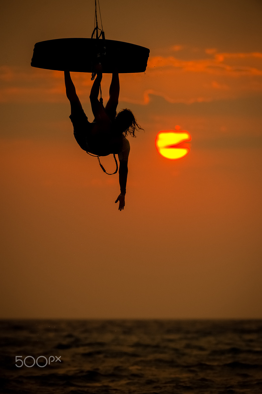 Nikon AF-S Nikkor 200-400mm F4G ED-IF VR sample photo. Kite surfer jumping from the water at sunset ocean photography
