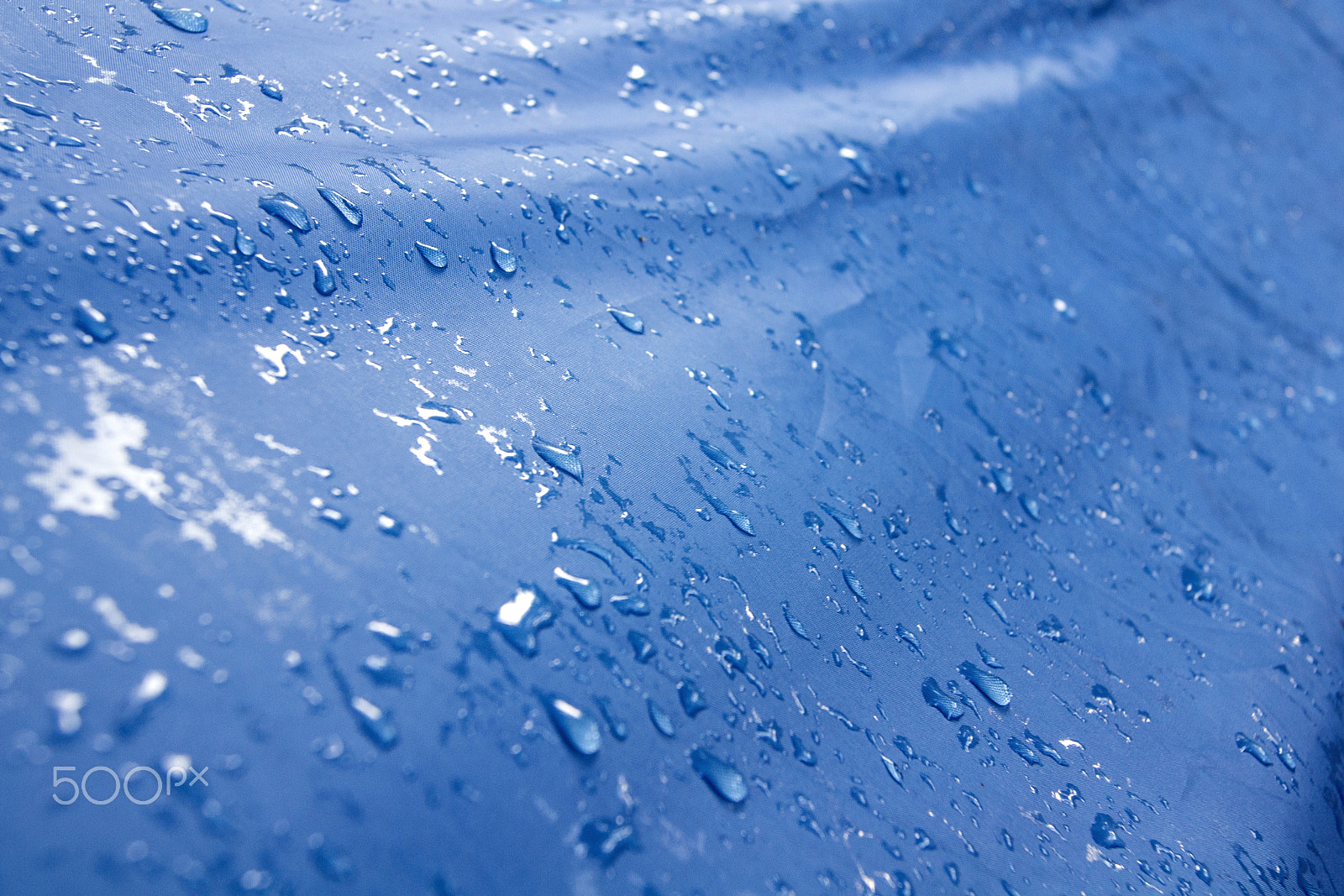 Sony Alpha DSLR-A500 + Sony DT 18-55mm F3.5-5.6 SAM sample photo. Water droplets on a blue tarp photography