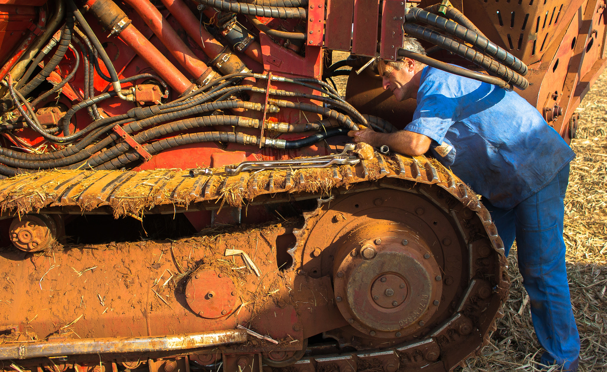 Sony Alpha NEX-5 sample photo. Repairing the sugarcane combine photography