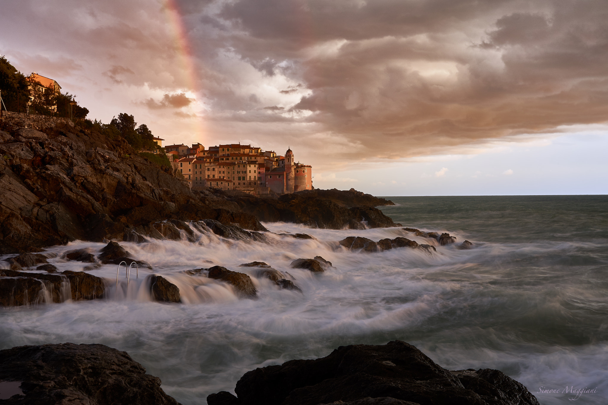 Sony FE 28mm F2 sample photo. Rainbow in storm photography