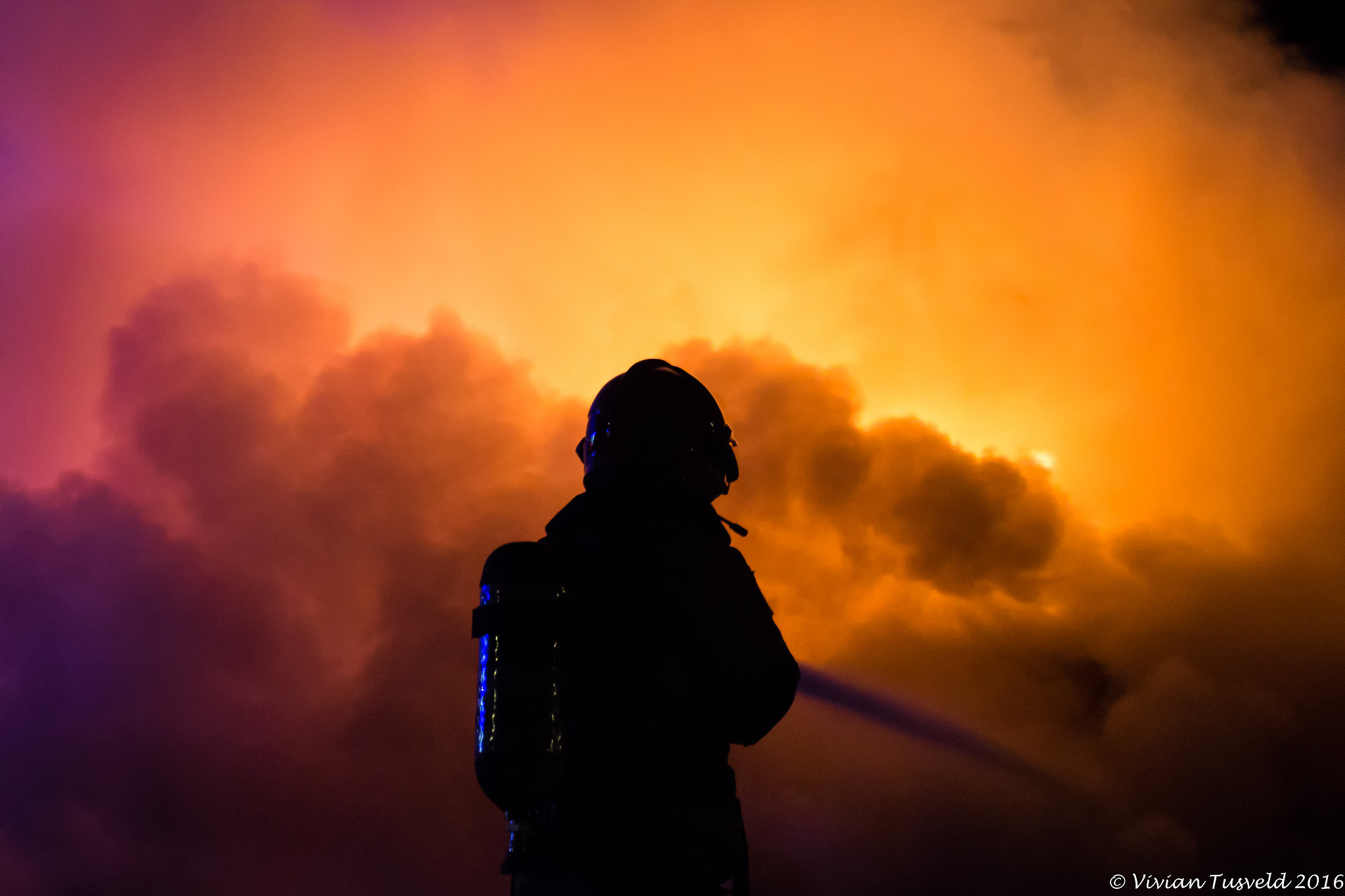 Canon EOS 600D (Rebel EOS T3i / EOS Kiss X5) + Sigma 24-70mm F2.8 EX DG Macro sample photo. Firefighter at work photography