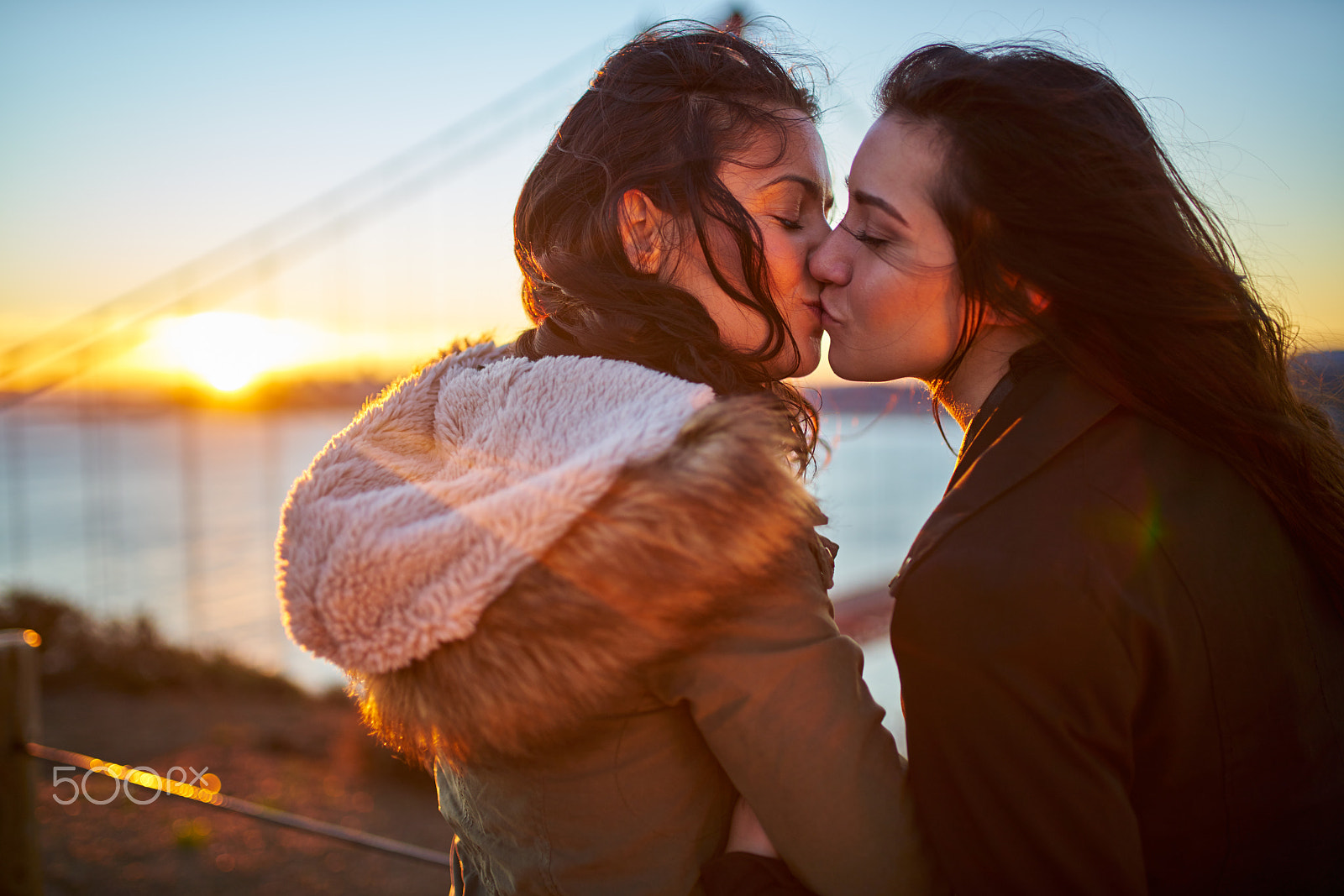 Sony a7R II + 35mm F1.4 G SSM sample photo. Romantic lesbian couple kissing at golden gate bridge photography