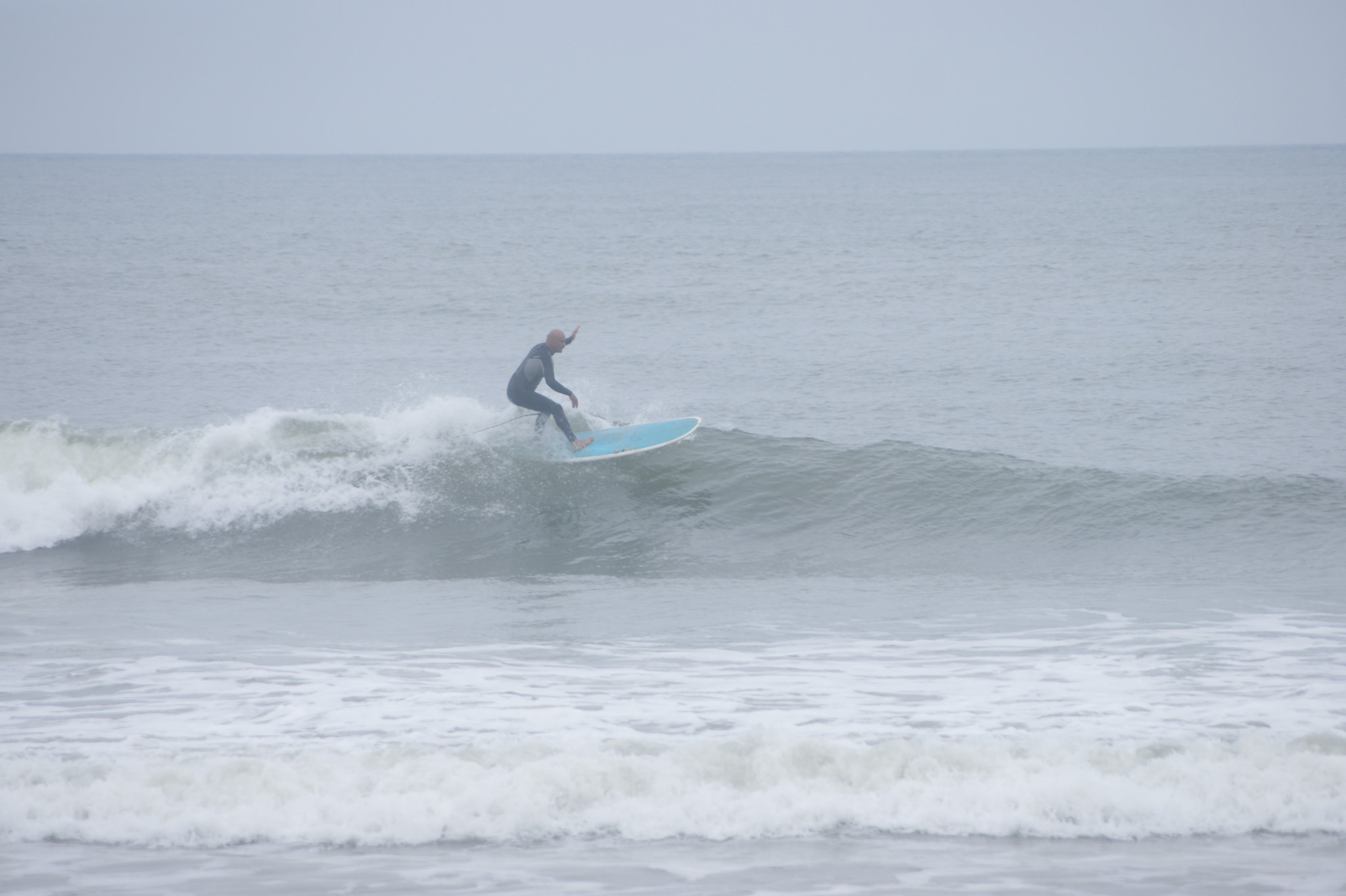 Sony Alpha DSLR-A390 + Sony DT 55-200mm F4-5.6 SAM sample photo. Lone surfer photography