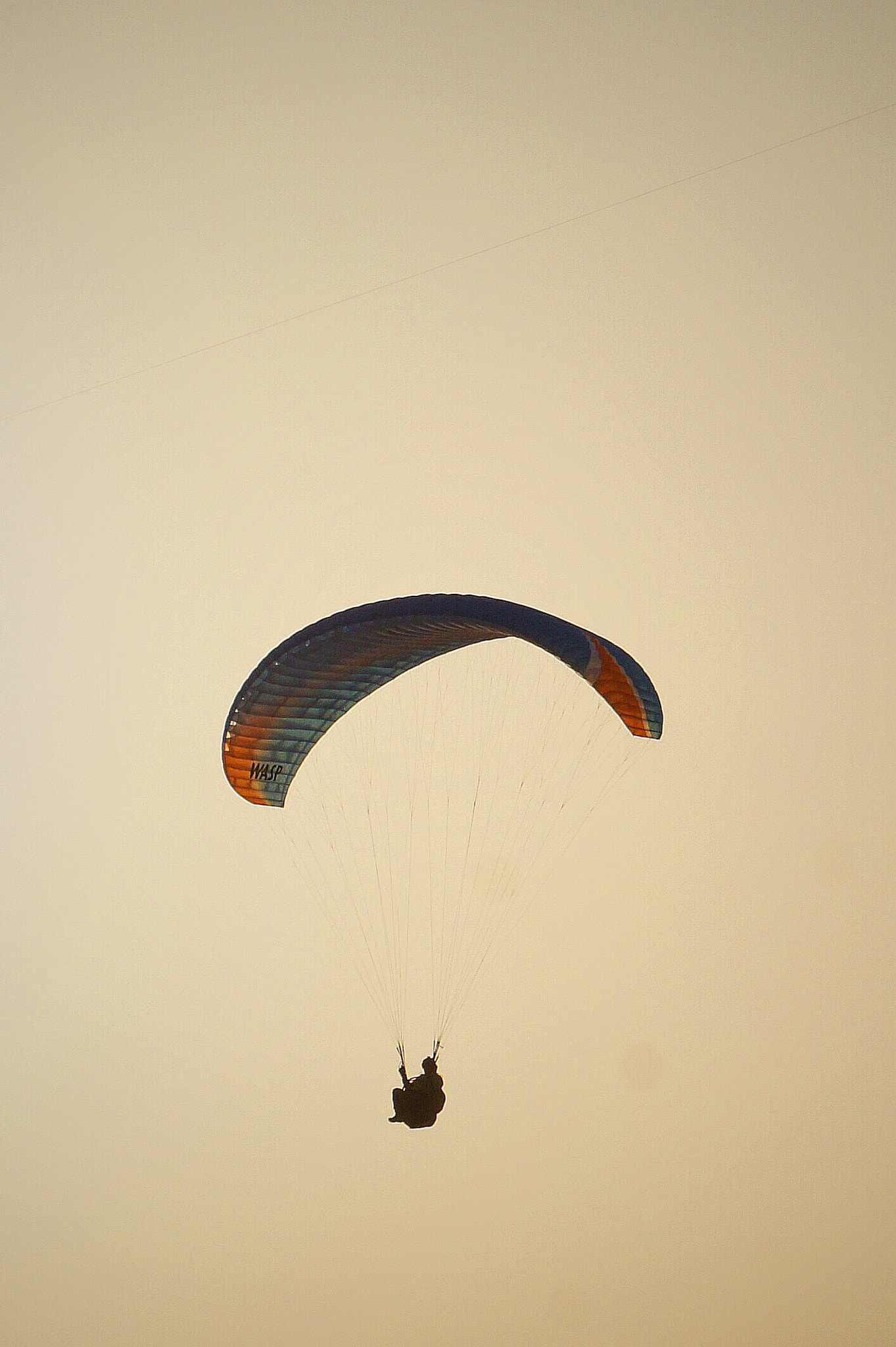 Sony E 18-200mm F3.5-6.3 OSS sample photo. Parasailing at sunset photography