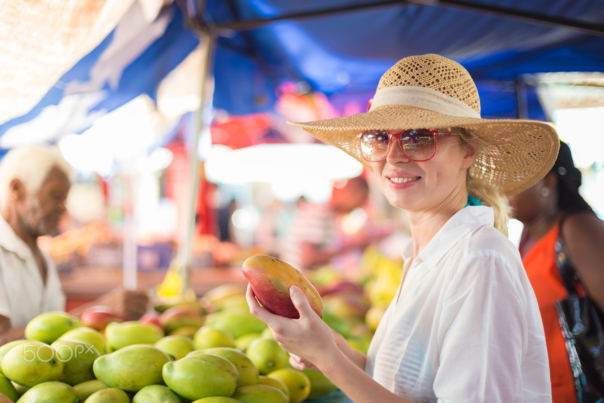 Traveler shopping on traditional Victoria food market, Seychelles.