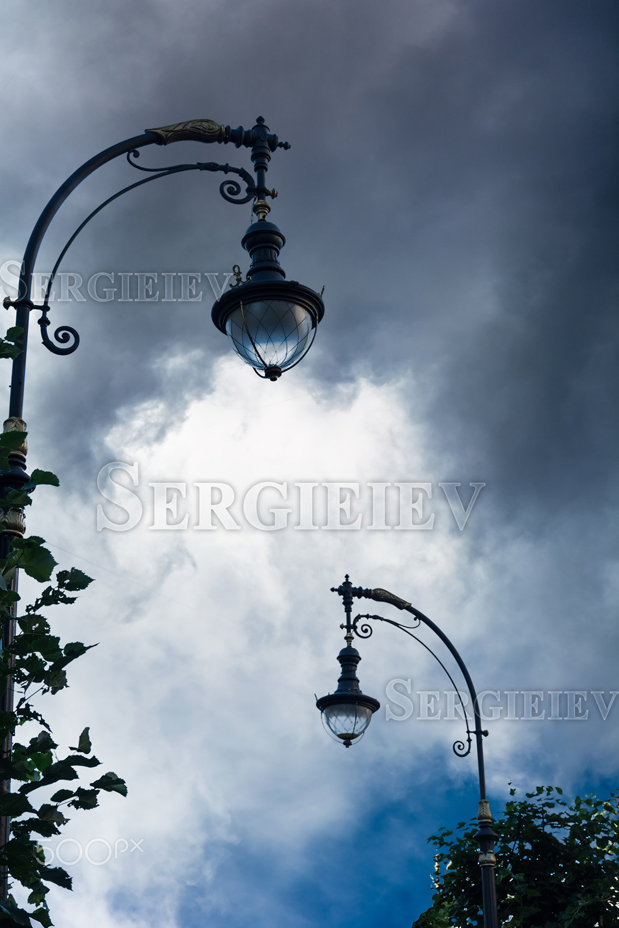 Silhouette of a street lamp on the background of the beautiful s