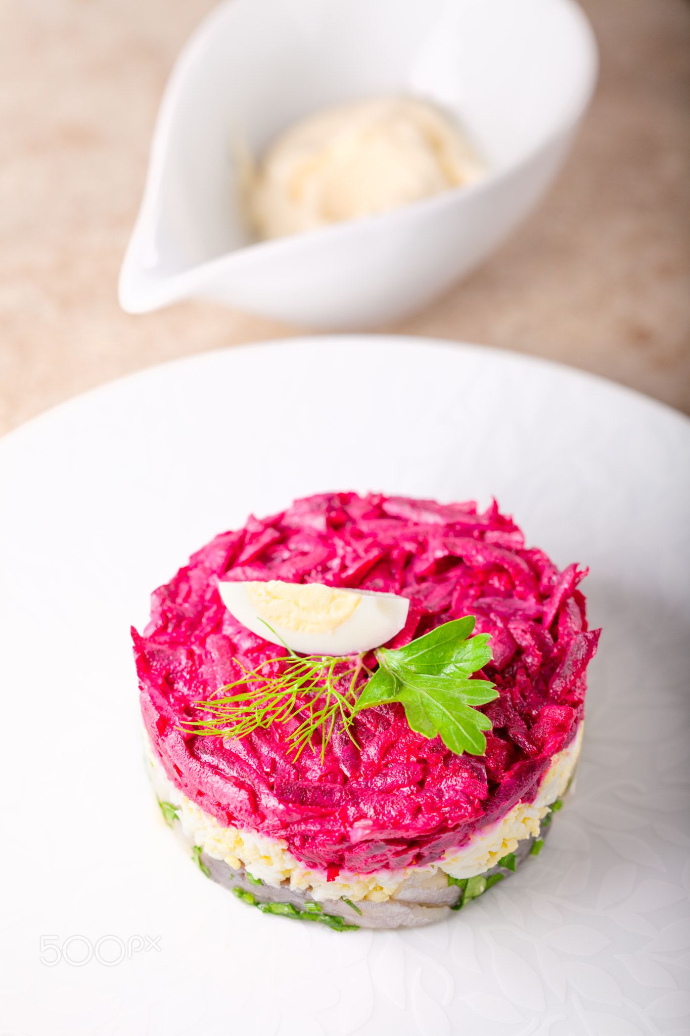 Matjes herring tartare on a white plate