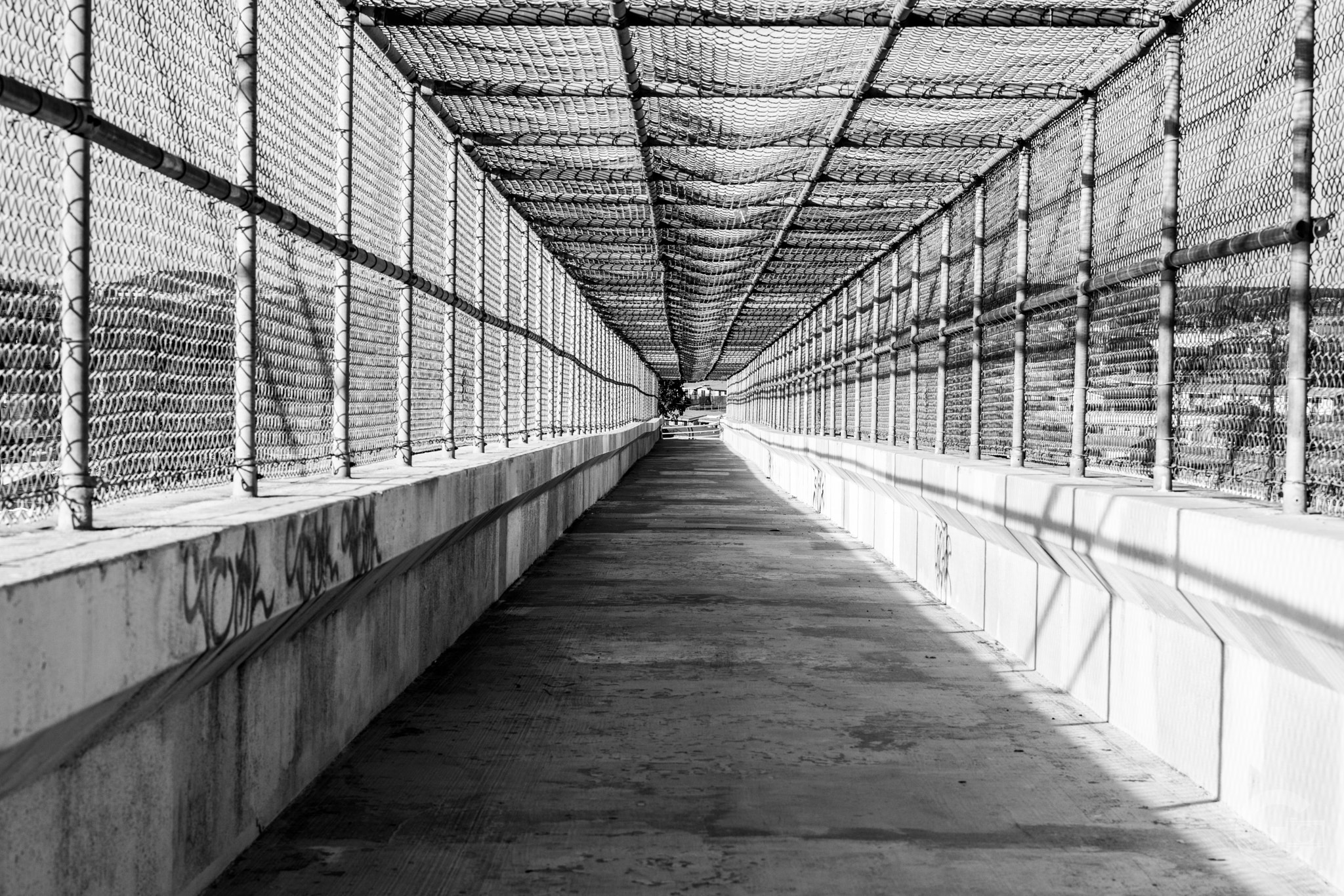 Sony FE 50mm F1.8 sample photo. Caged bridge photography