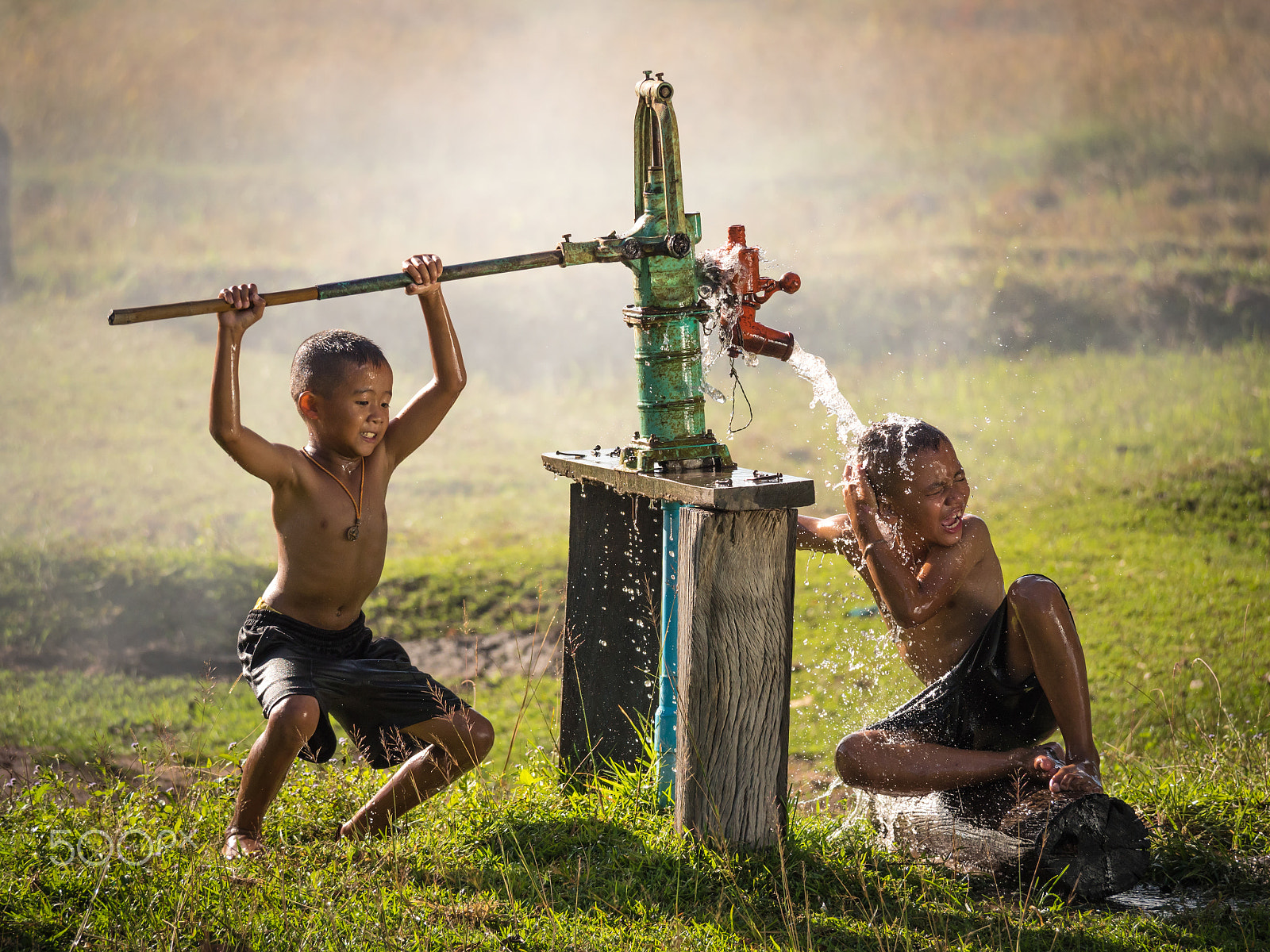 Panasonic Lumix DMC-GH4 sample photo. Two young boy rocking groundwater bathe in the hot days, country photography