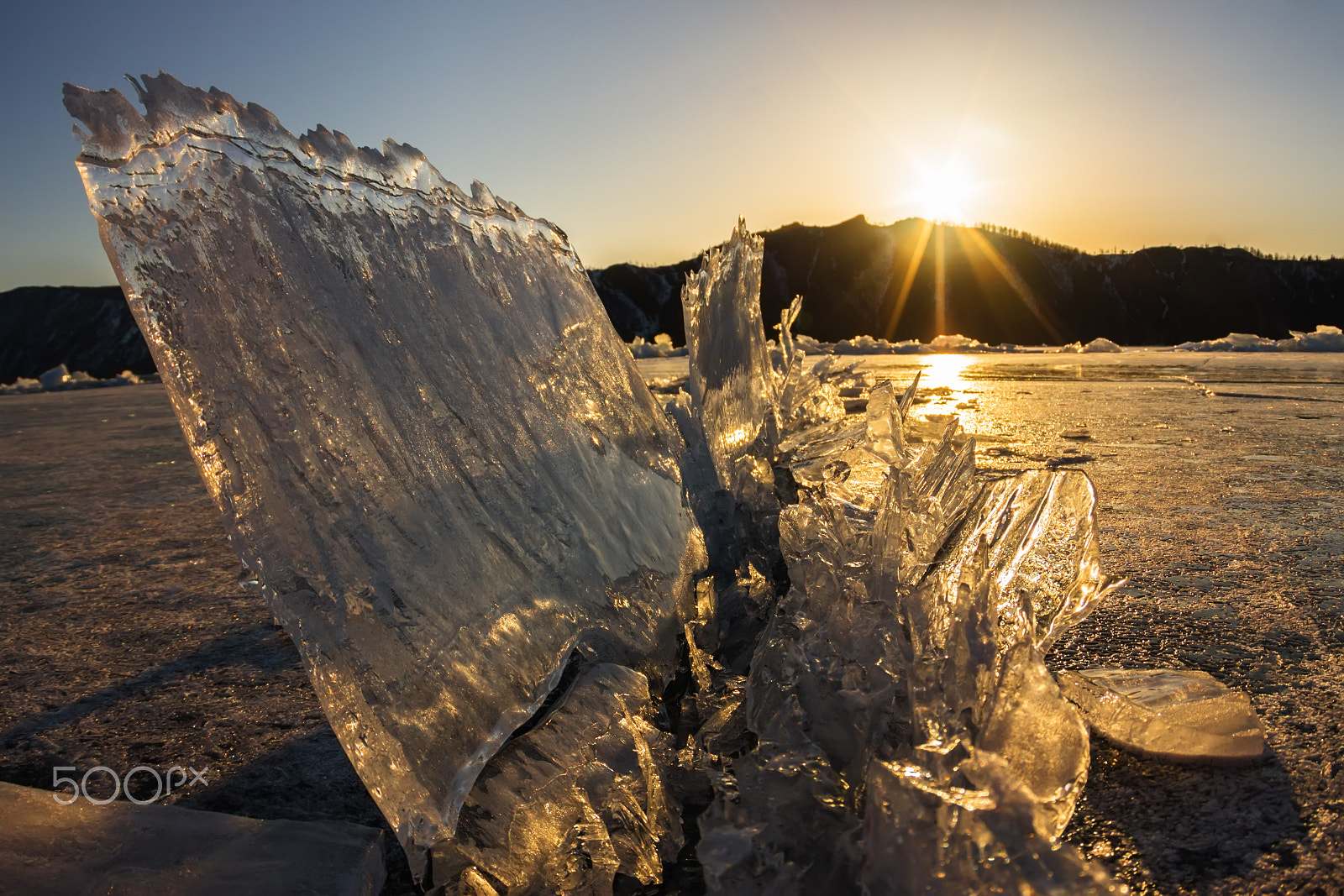 Canon EOS 1100D (EOS Rebel T3 / EOS Kiss X50) sample photo. Comb transparent ice is above a crack at sunset, olkhon island, photography