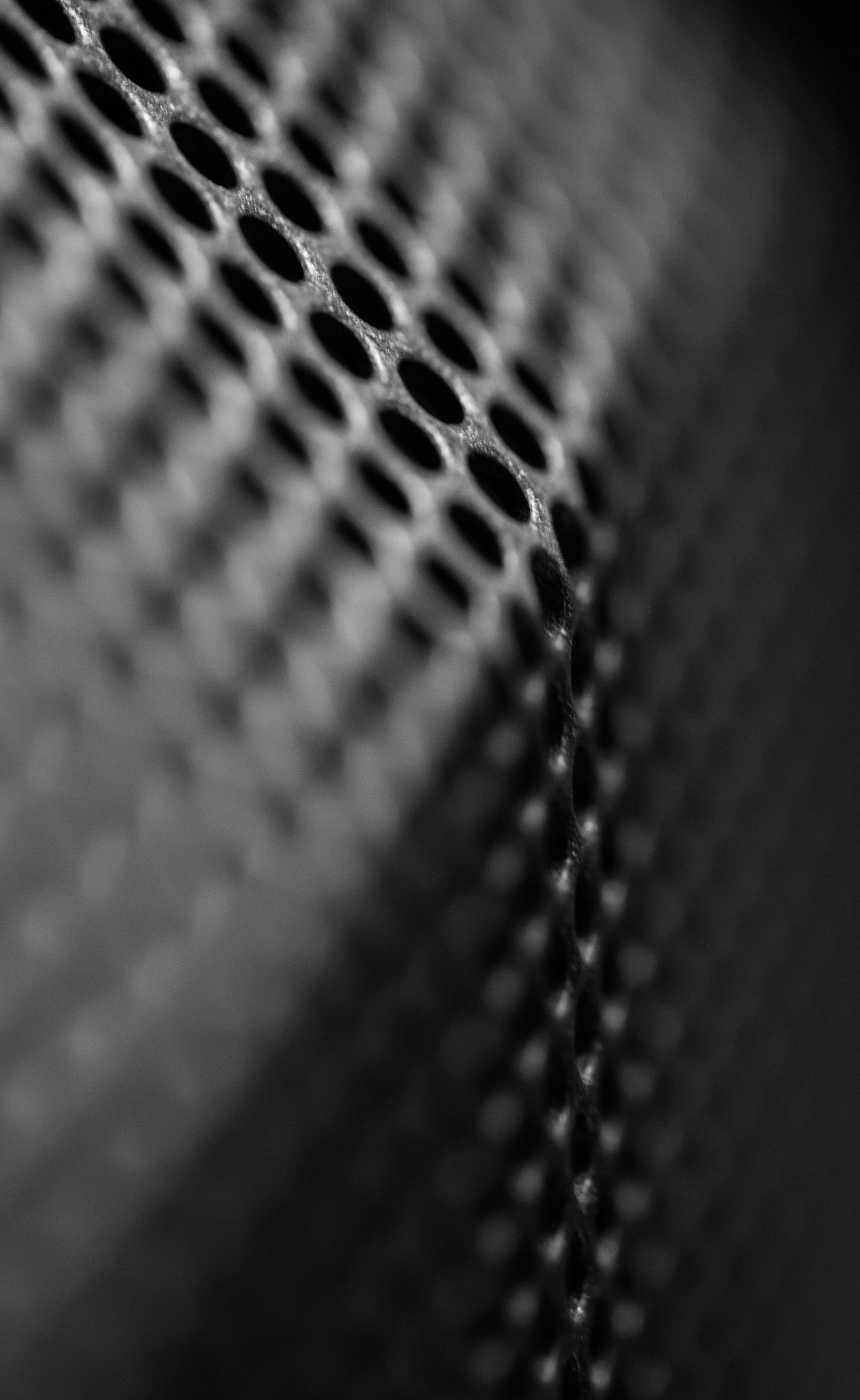Canon EF-S 60mm F2.8 Macro USM sample photo. Black holes on an angled surface photography