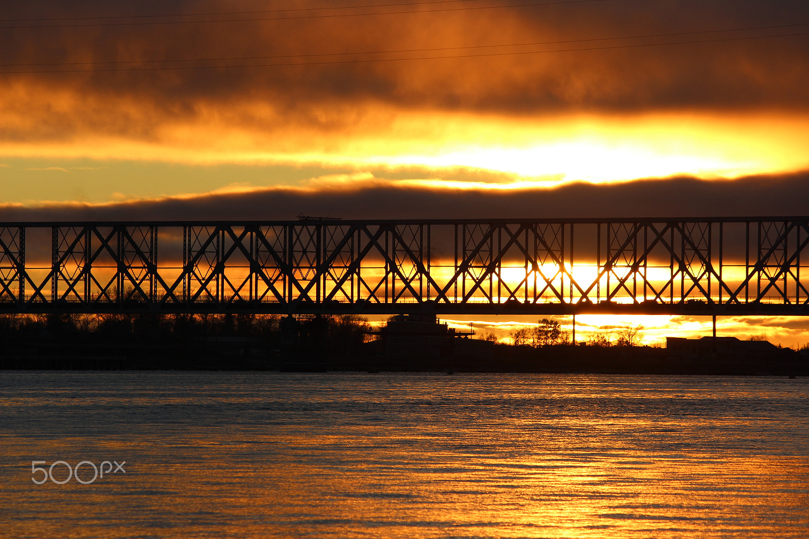 Canon EOS 600D (Rebel EOS T3i / EOS Kiss X5) sample photo. Silhouette of metal city bridge over the river against the background  sunset photography