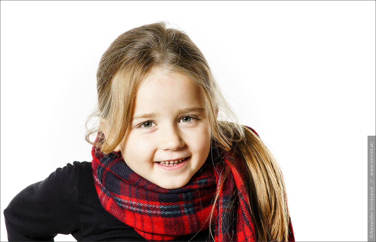 Sony a99 II sample photo. Cute little girl dressing by red comfort scarf photography