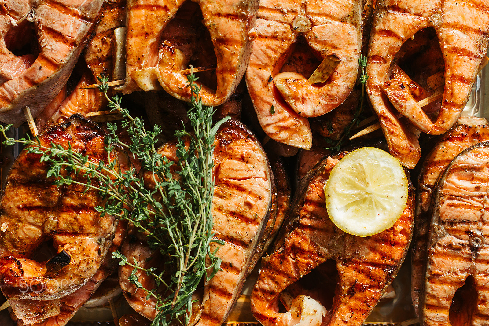 Canon EOS-1D Mark IV sample photo. Grilled salmon steak on the flaming. close up photography