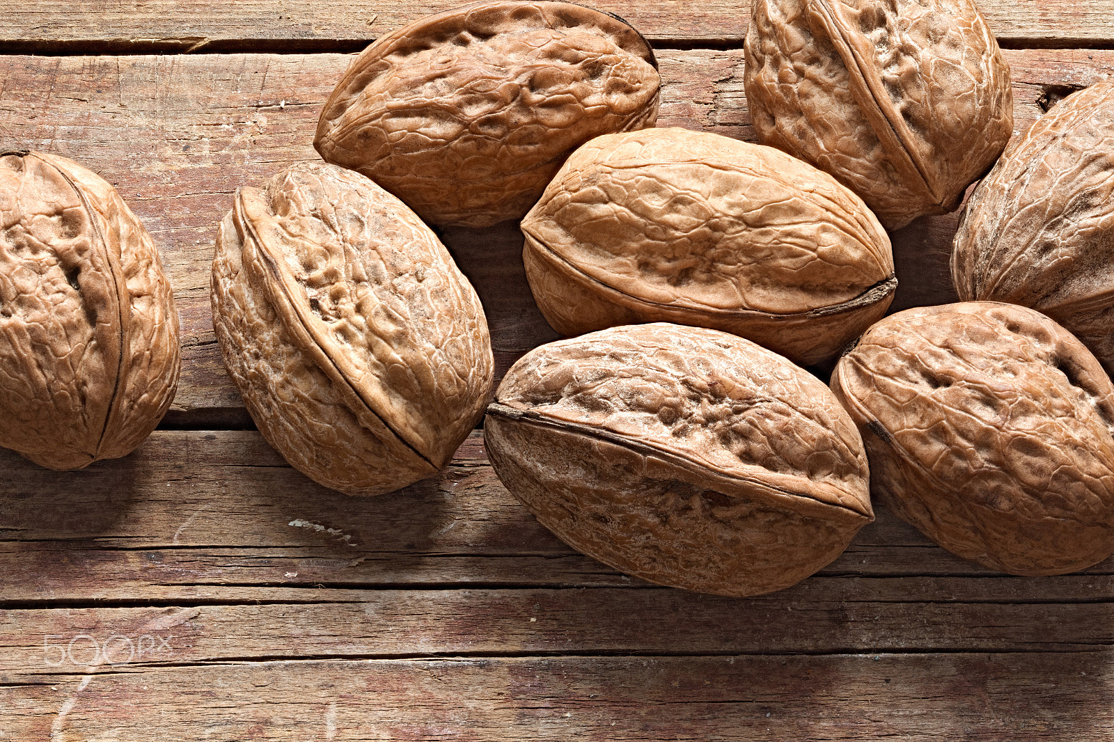 Canon EOS 650D (EOS Rebel T4i / EOS Kiss X6i) sample photo. Walnuts on a rough wooden background photography