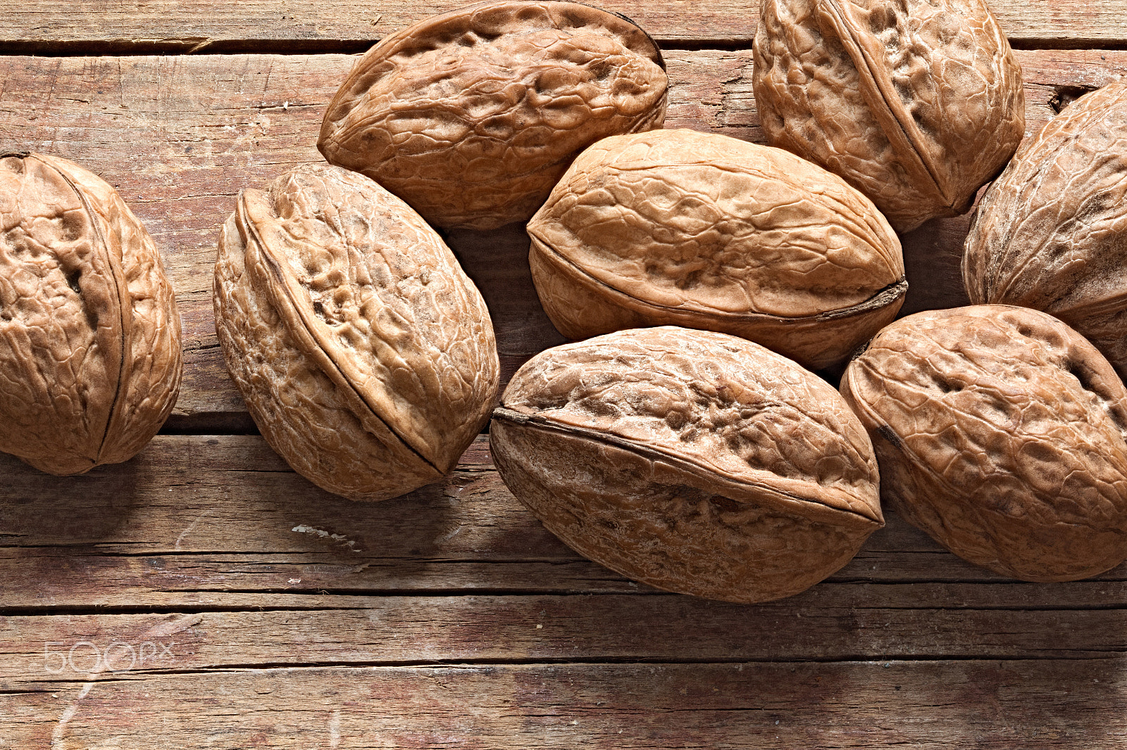 Canon EF 100mm F2.8 Macro USM sample photo. Walnuts on a rough wooden background photography