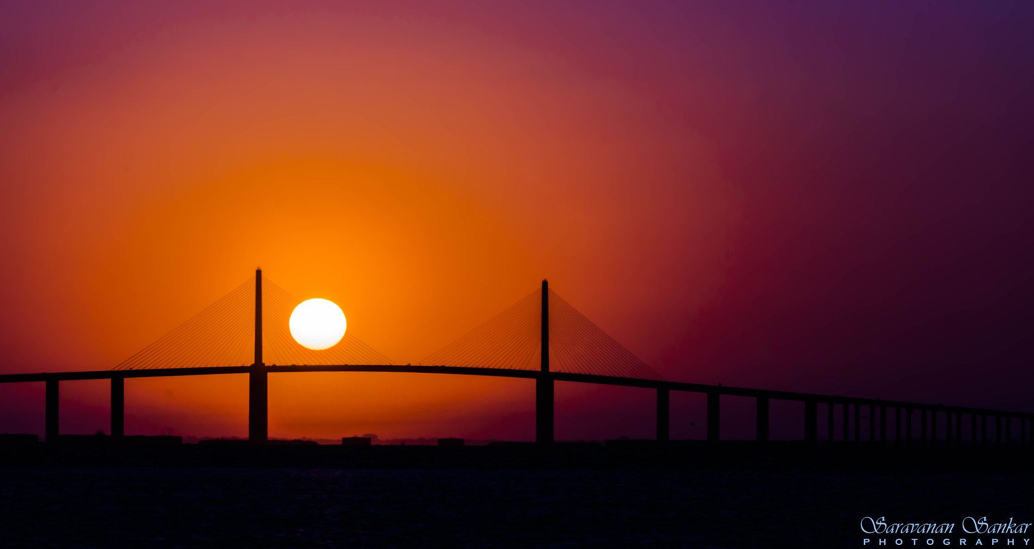 Sony SLT-A65 (SLT-A65V) sample photo. Sunrise over sunshine skyway bridge photography