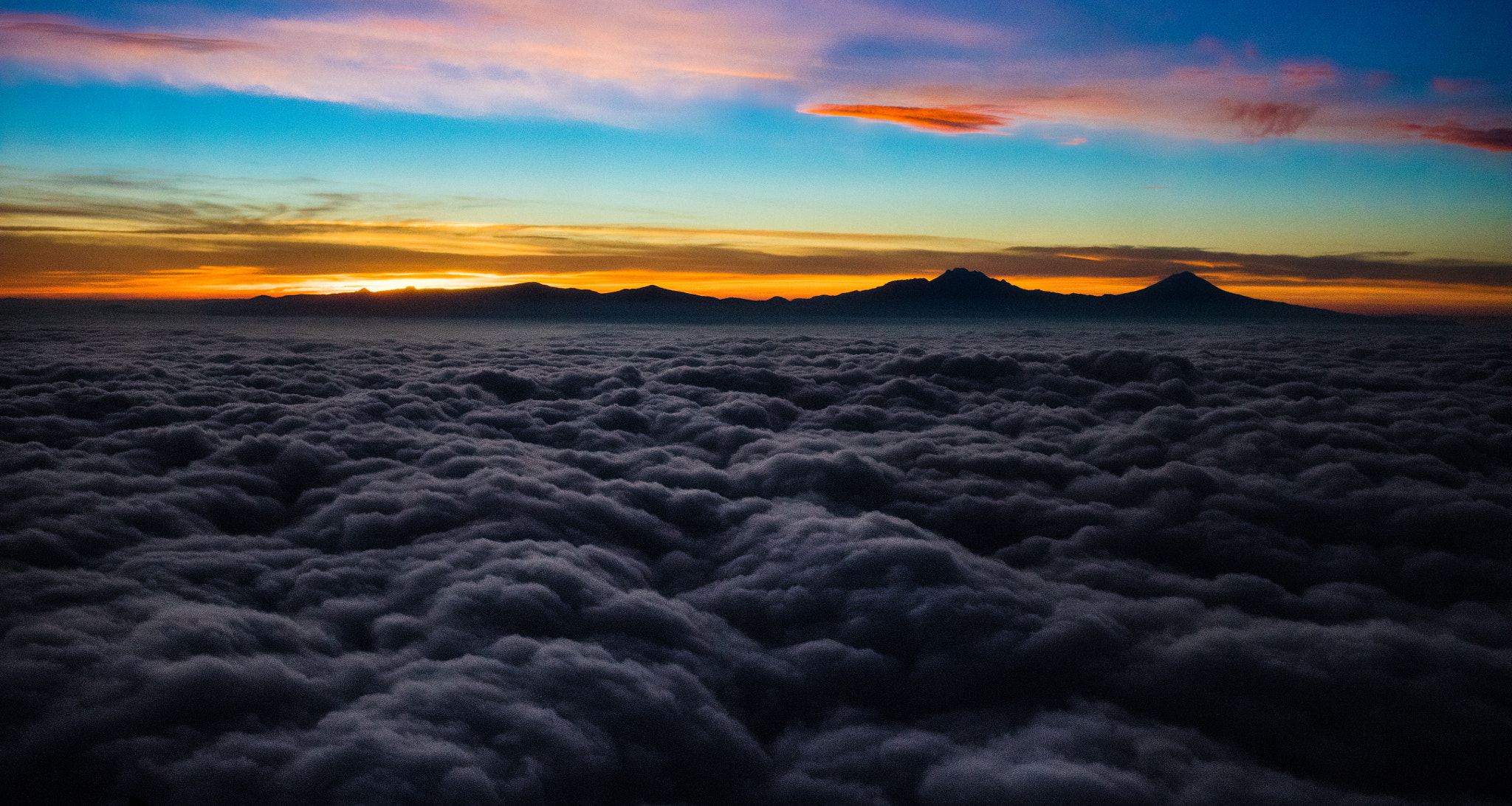 Canon EF 40mm F2.8 STM sample photo. Over the clouds photography