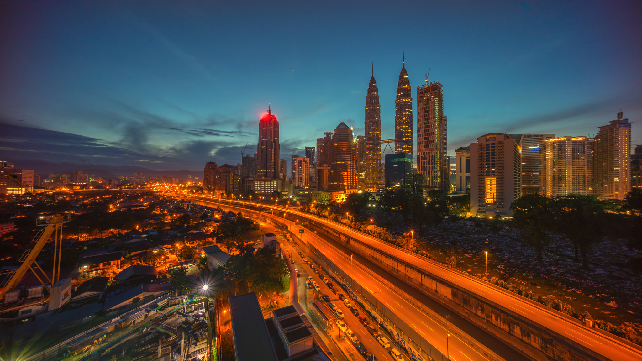 Sony a7R + Sony E 10-18mm F4 OSS sample photo. Dramatic blue hour sunrise over kuala lumpur city skyline photography