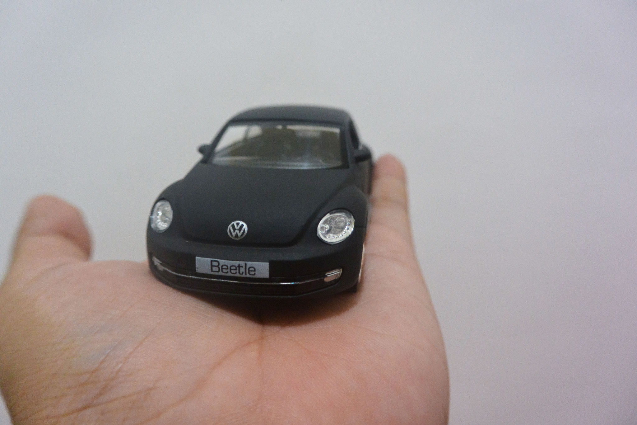 Nikon 1 J3 sample photo. Black matte vw beetle die cast photography