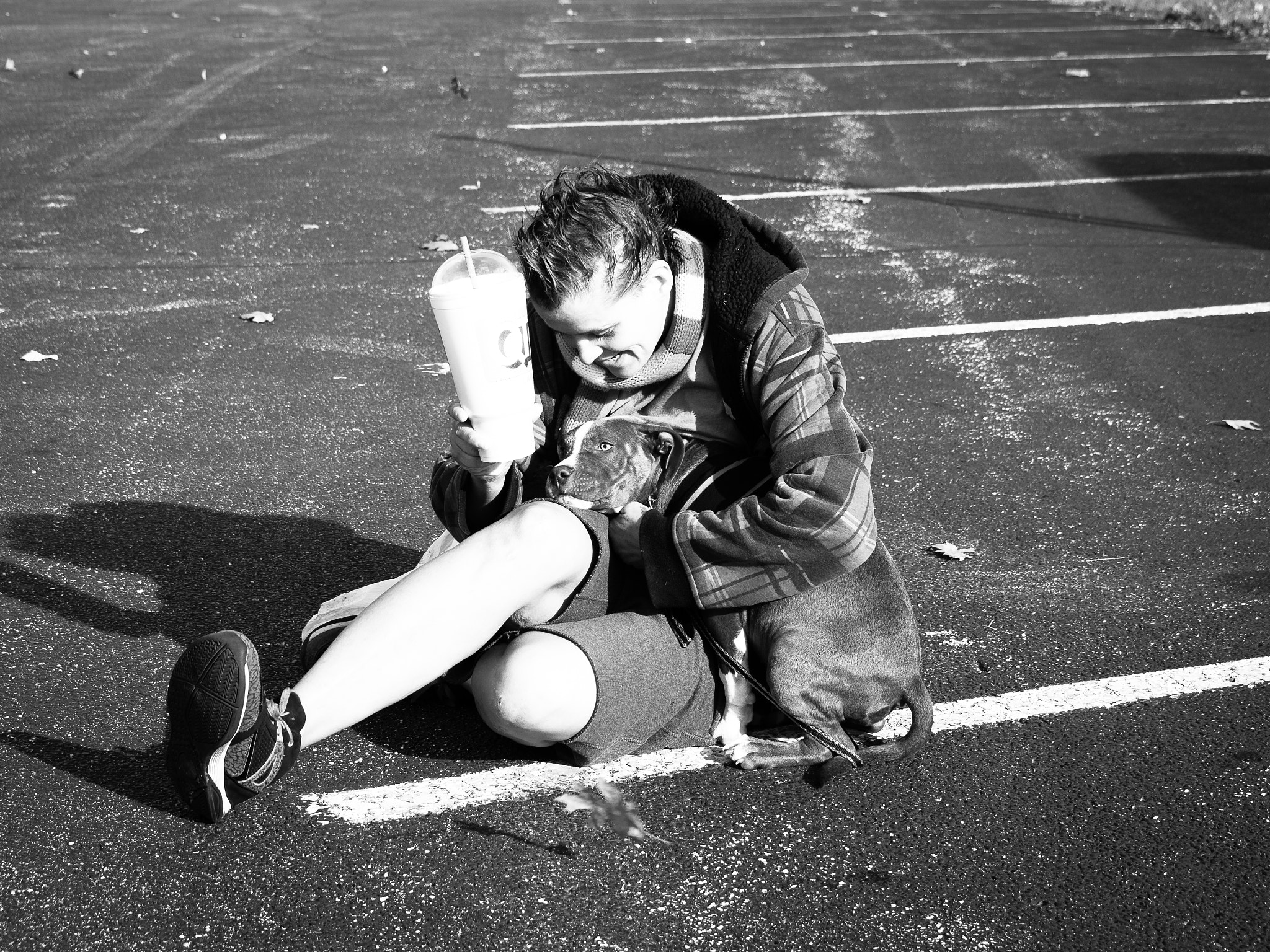 Olympus PEN-F sample photo. Homeless girl in parking lot with pet photography