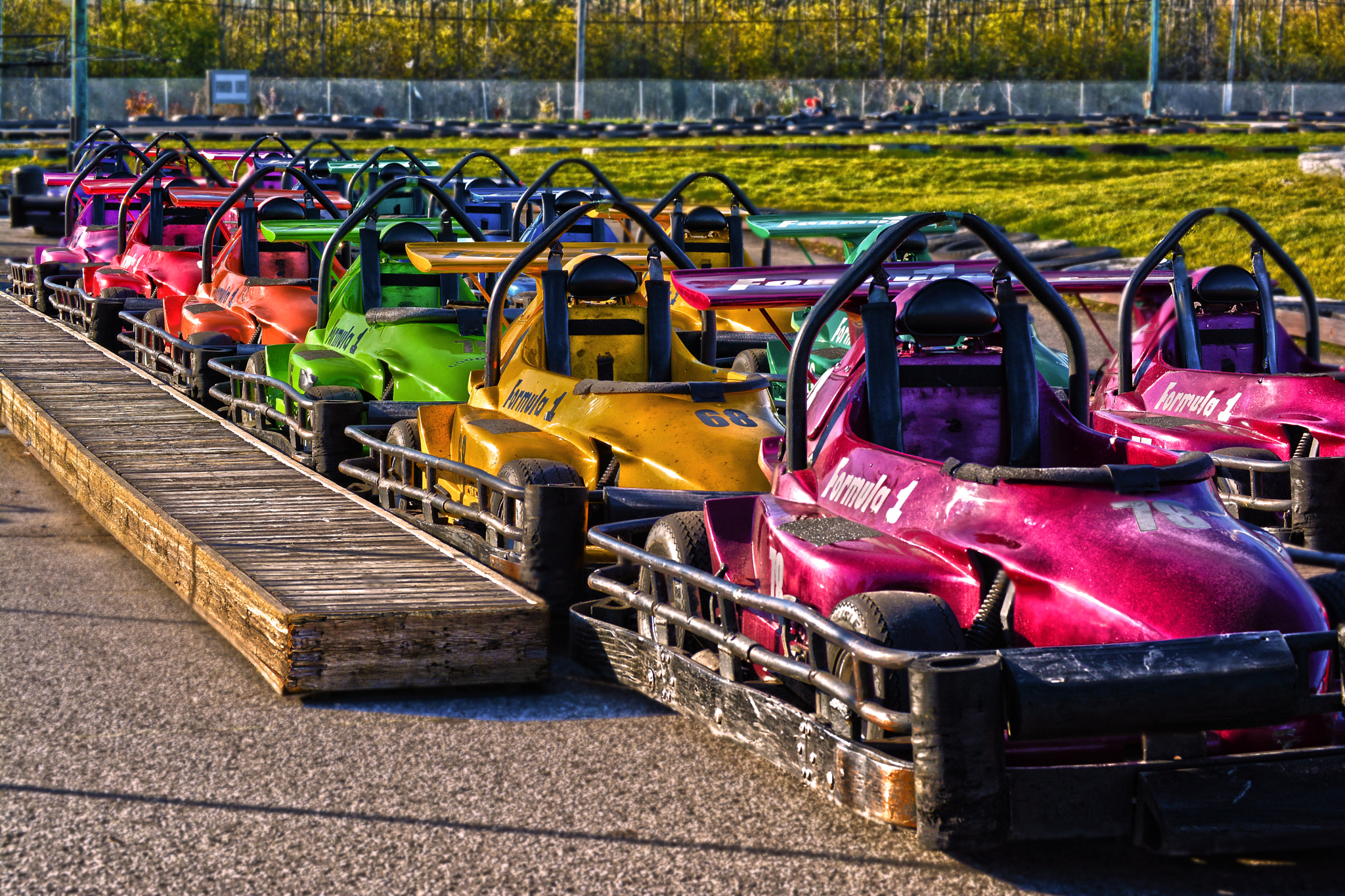 Nikon D5200 + Nikon AF-S DX Nikkor 55-200mm F4-5.6G ED sample photo. Go kart rainbow photography