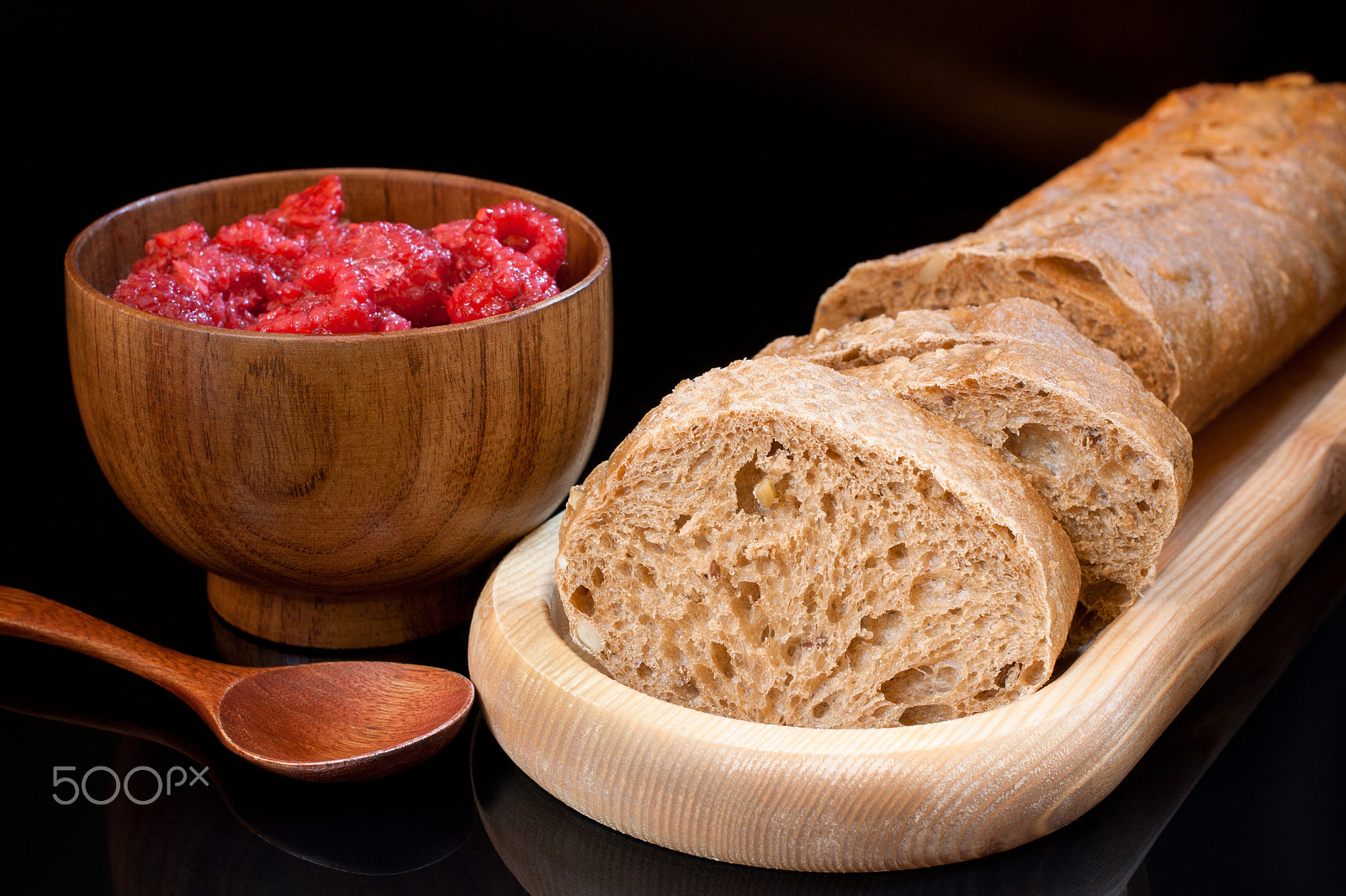 Canon EF 40mm F2.8 STM sample photo. Bread and cup with raspberry on black background photography