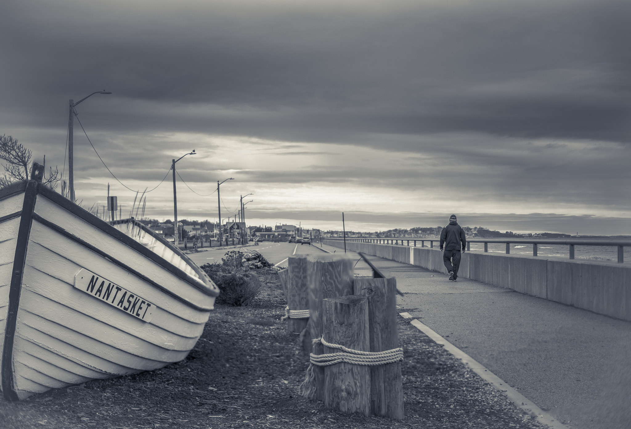 Pentax K-1 + Pentax smc DA 50mm F1.8 sample photo. Man walking by rescue boat photography