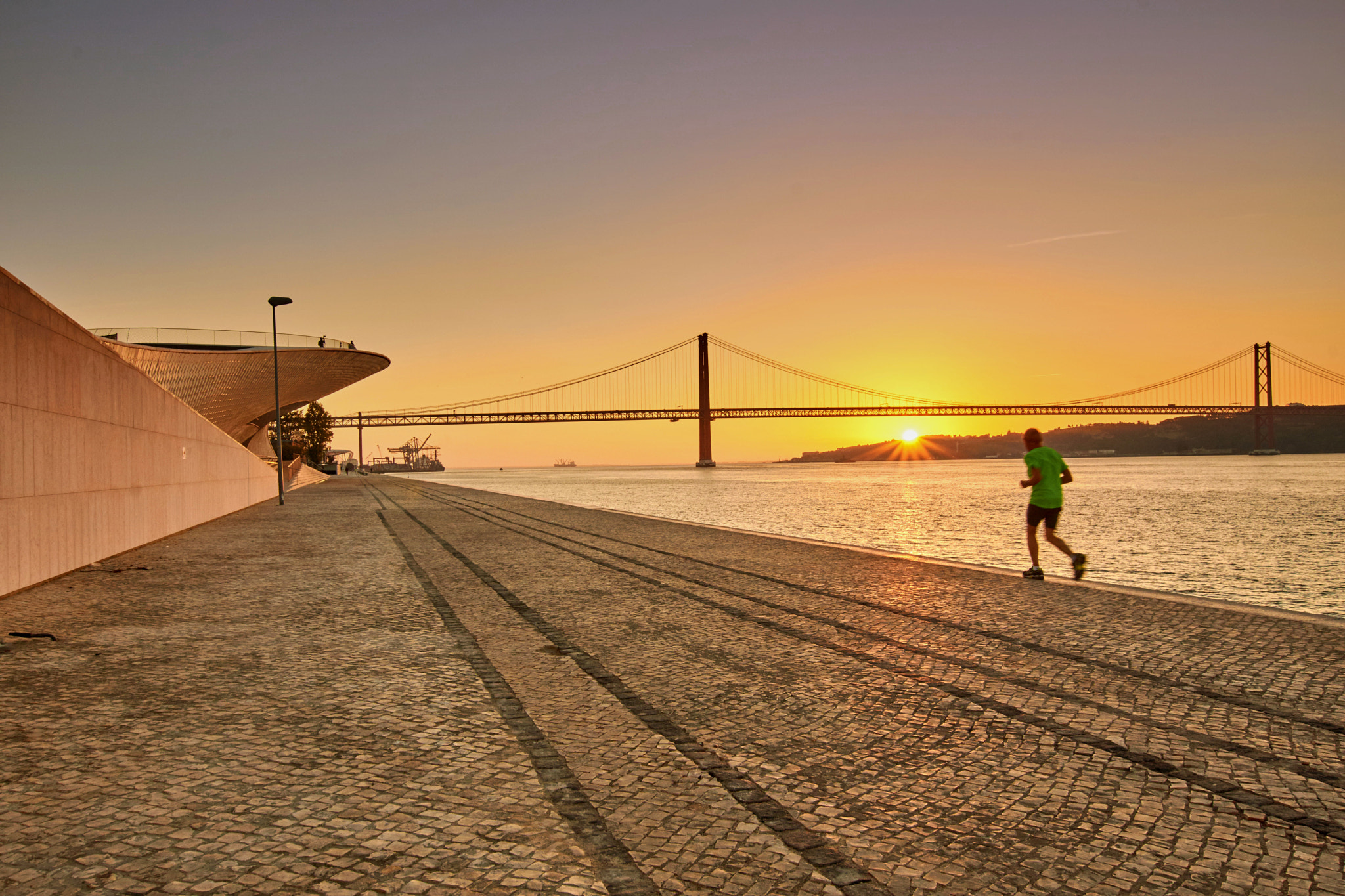 Sony SLT-A65 (SLT-A65V) sample photo. The runner by the river photography