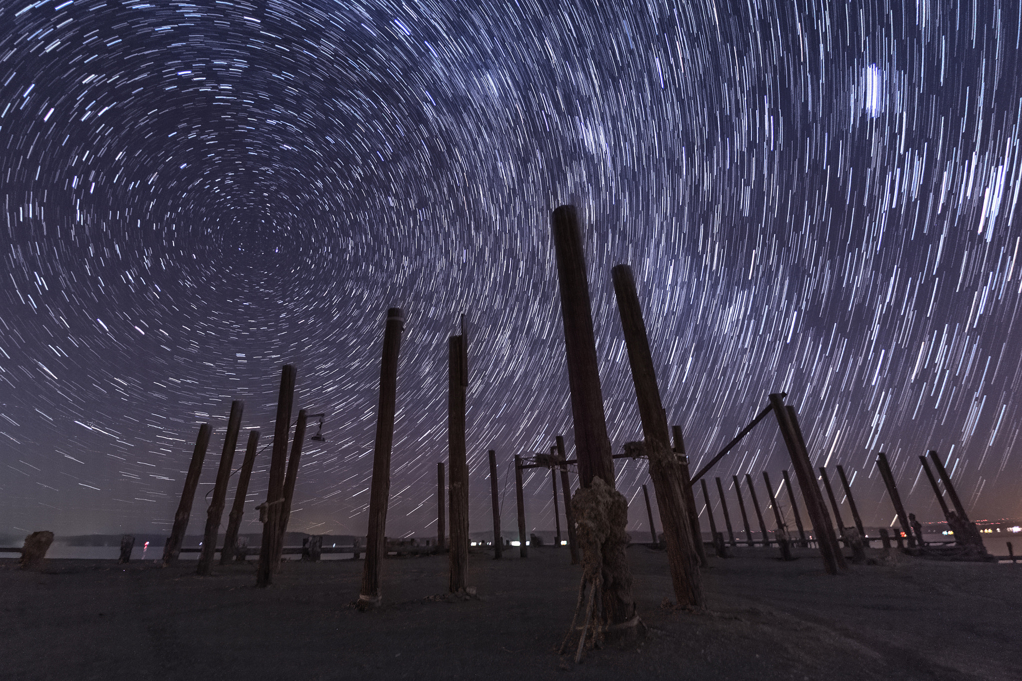 Canon EOS 6D + Sigma 15mm f/2.8 EX Fisheye sample photo. Star trails over an abandoned pier photography