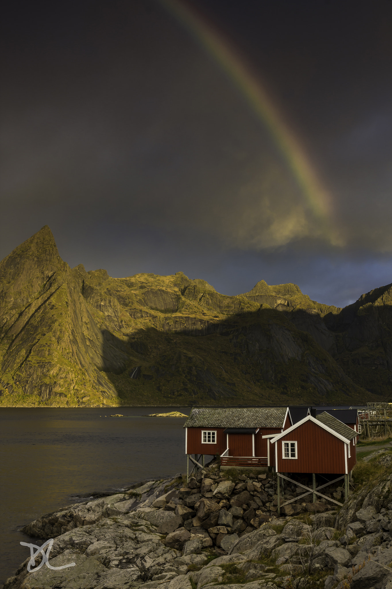 Canon EOS 600D (Rebel EOS T3i / EOS Kiss X5) + Canon EF 16-35mm F4L IS USM sample photo. Rainbow over the rorbu of hamnoy photography