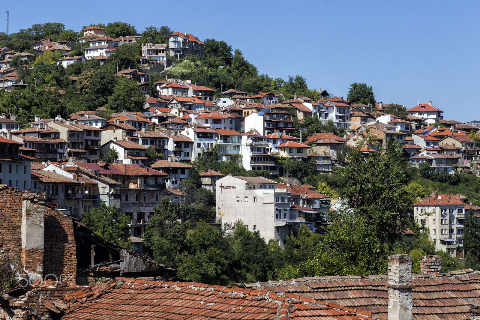 Canon EF 100mm F2.8 Macro USM sample photo. Daytime skyline of houses and buildings in veliko photography