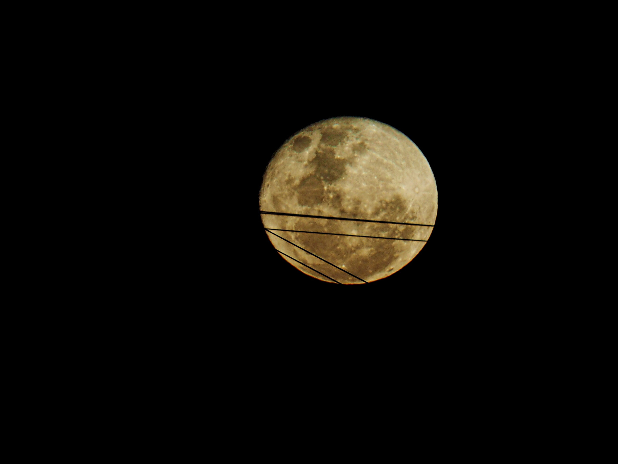 Olympus OM-D E-M10 sample photo. The super moon.  low in the sky, behind a set of power lines. photography